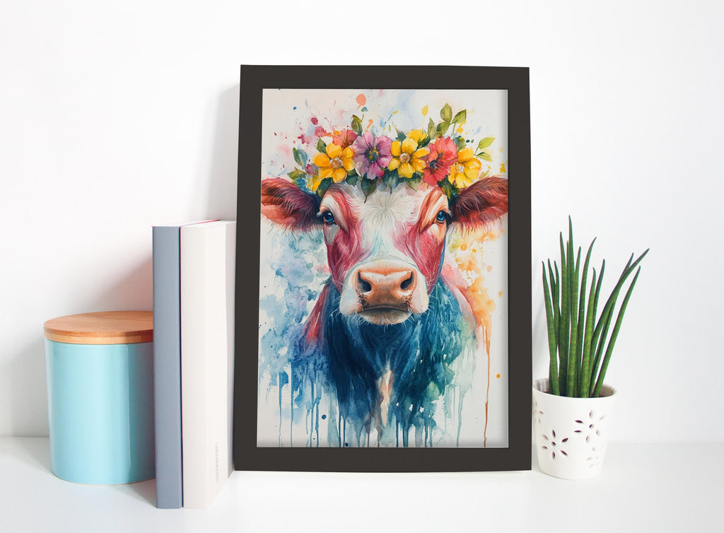 a framed painting of a cow with a colorful flower crown on its head, placed on a shelf next to a blue container and a white pot with a plant.