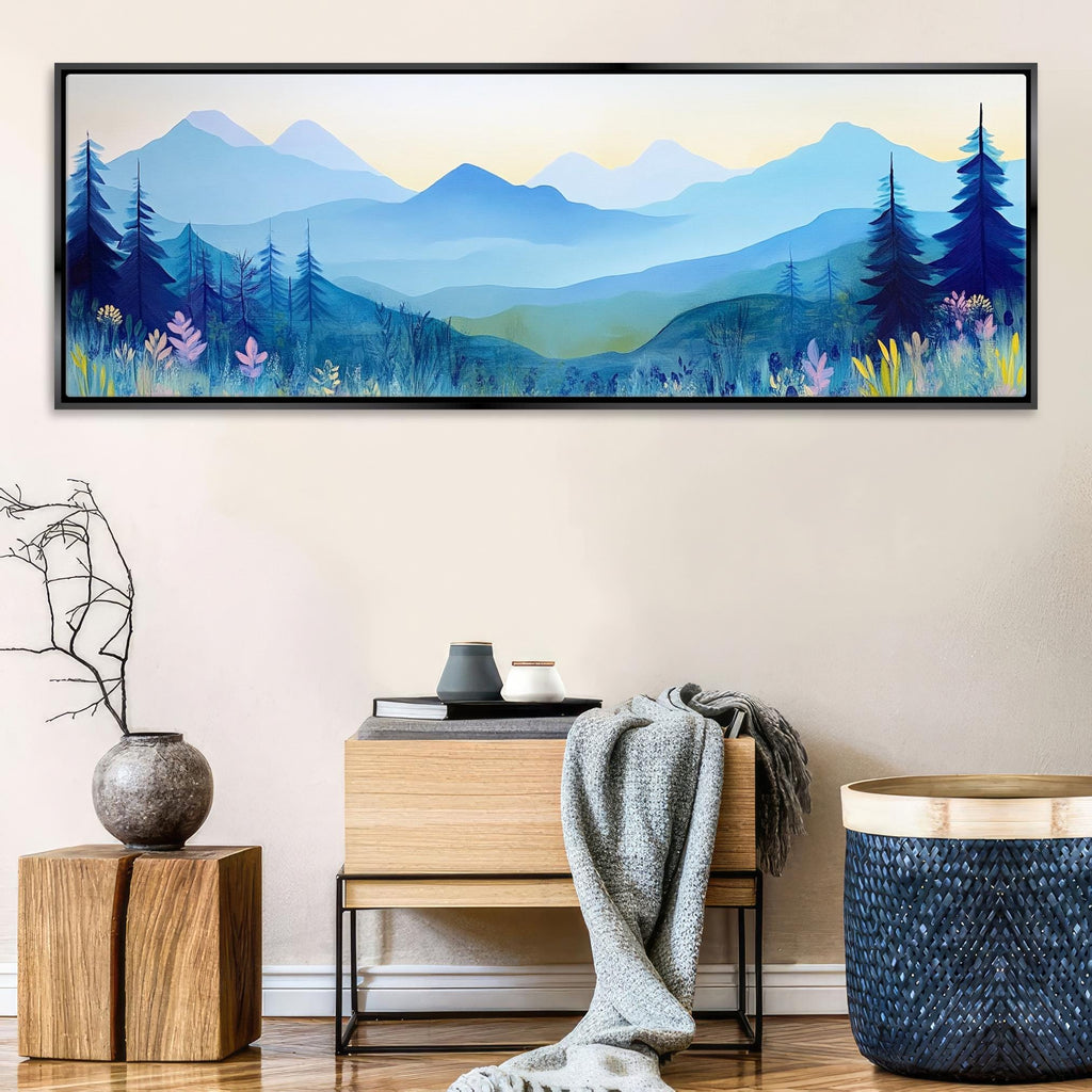a painting of a blue mountain scene hangs on a wall