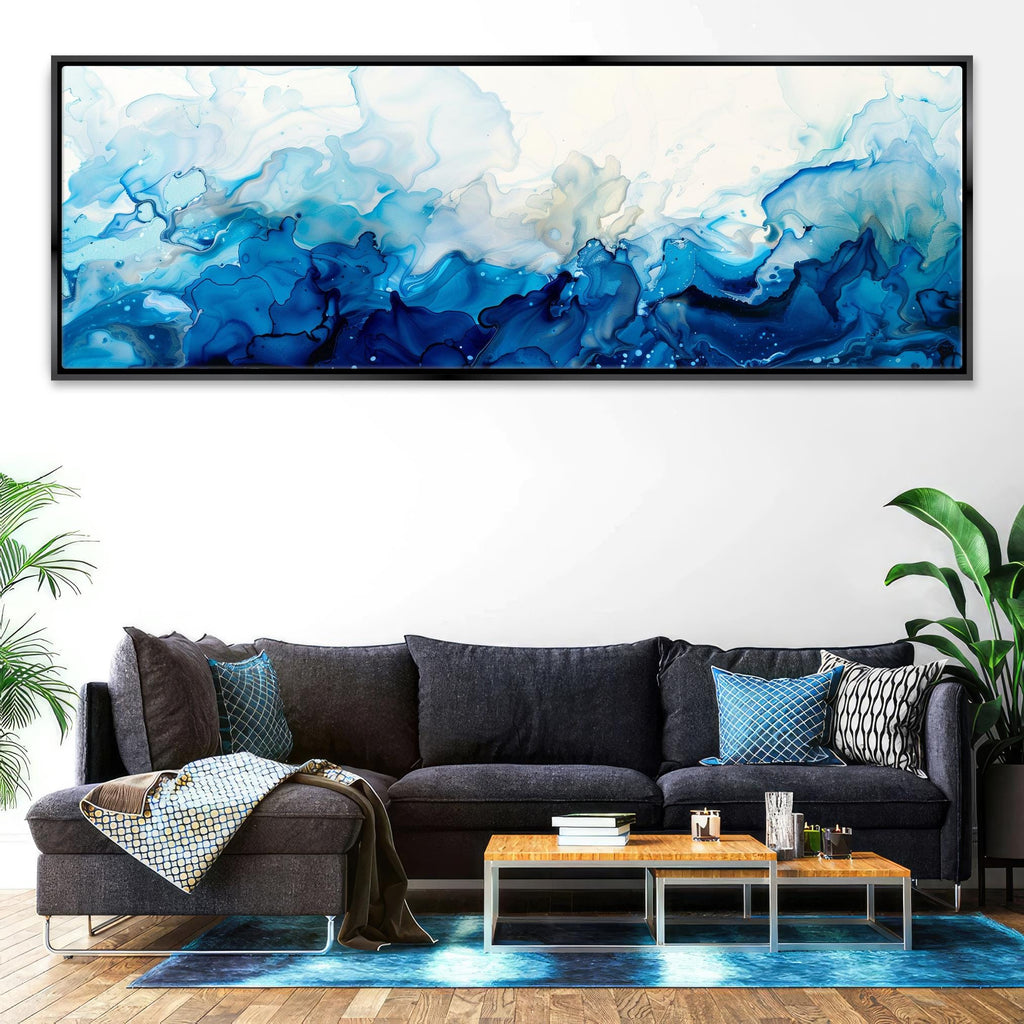 a living room with a couch and a painting on the wall
