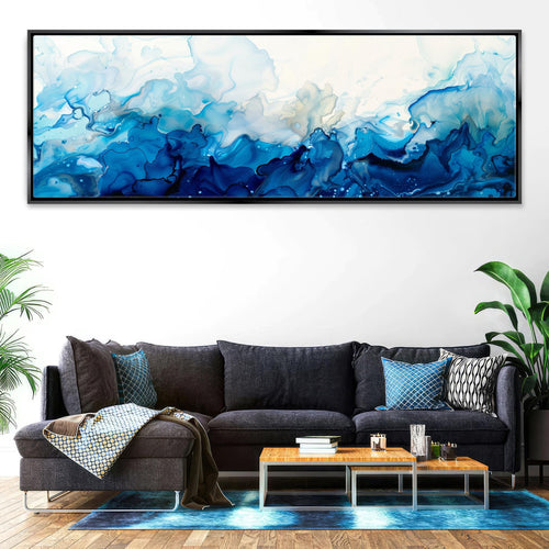 a living room with a couch and a painting on the wall