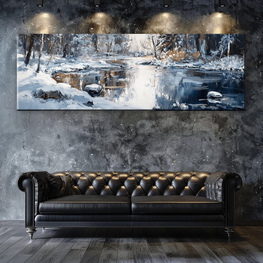 a couch sitting in front of a painting on a wall