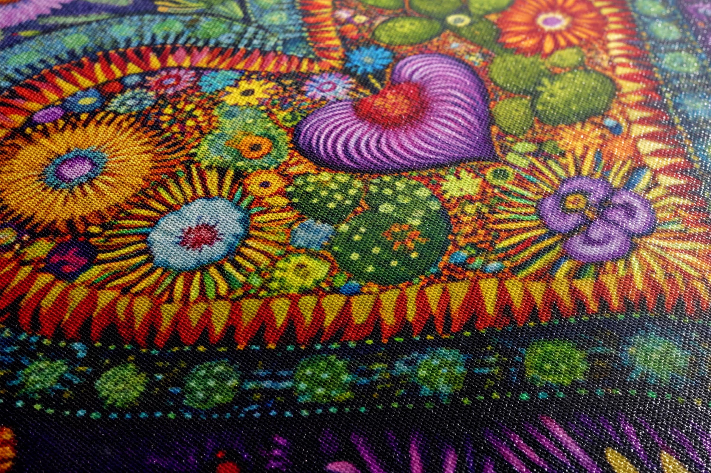 a close up of a colorful painting on a canvas