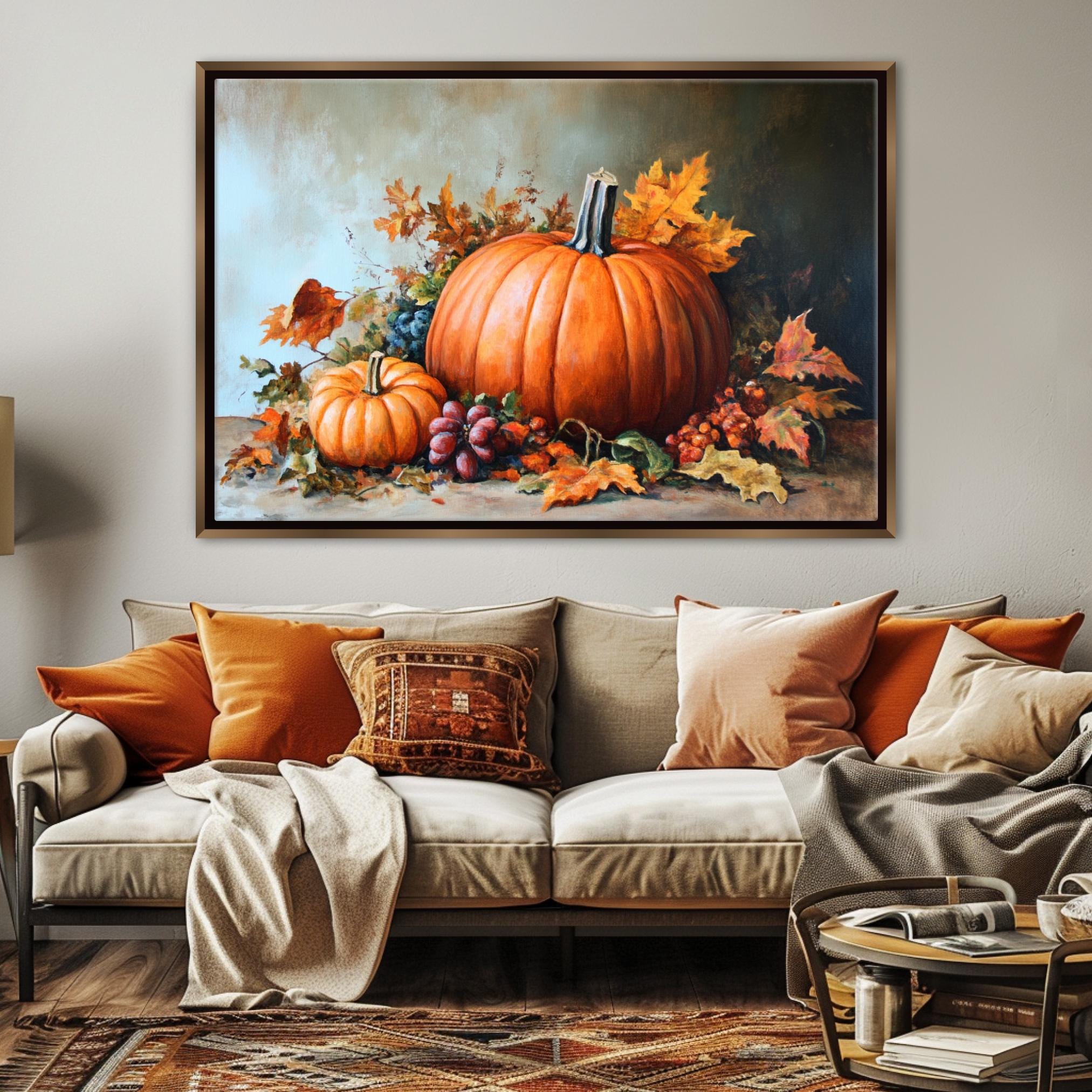 a large painting of pumpkins and autumn leaves hanging on a wall above a couch in a living room.