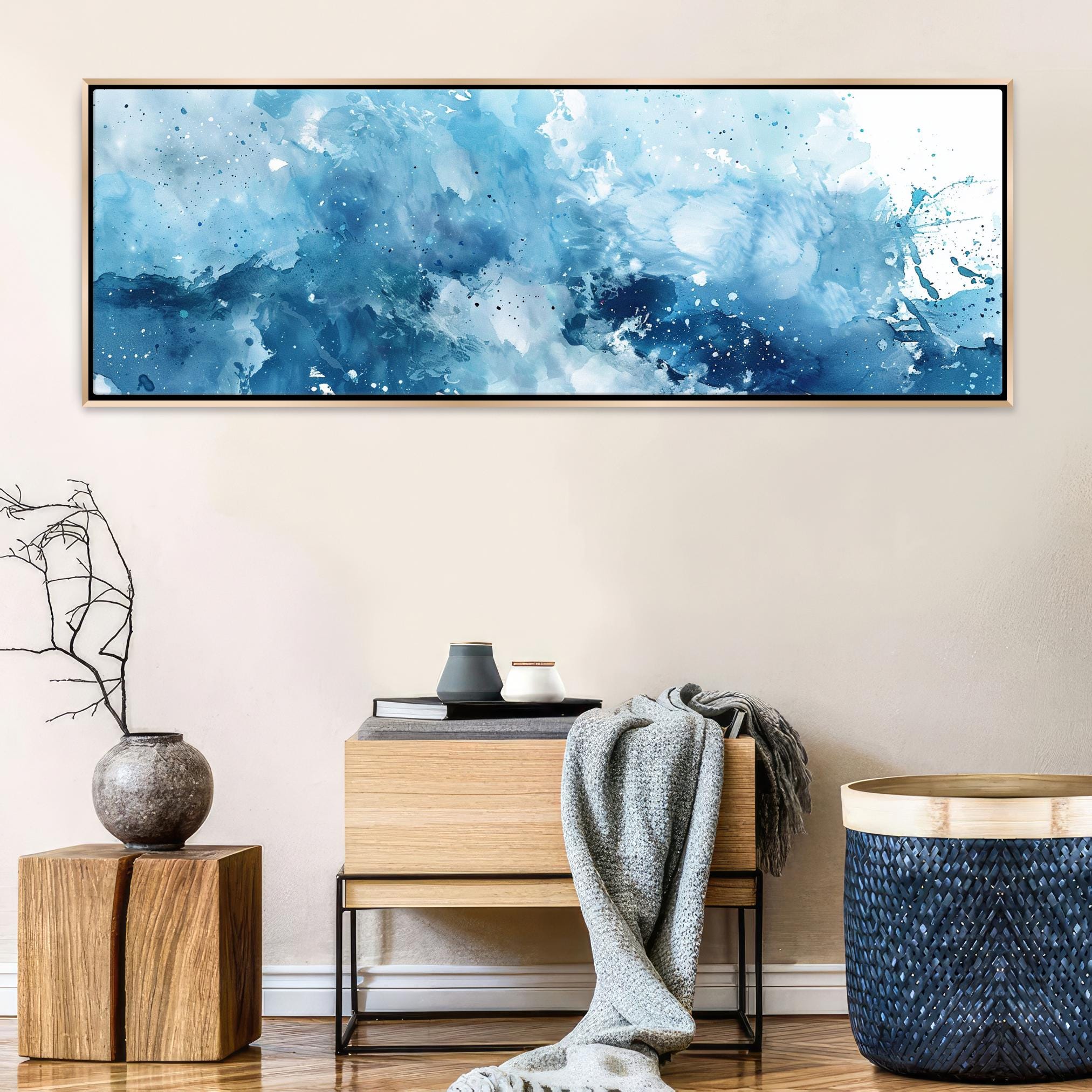 a painting hanging on a wall above a table