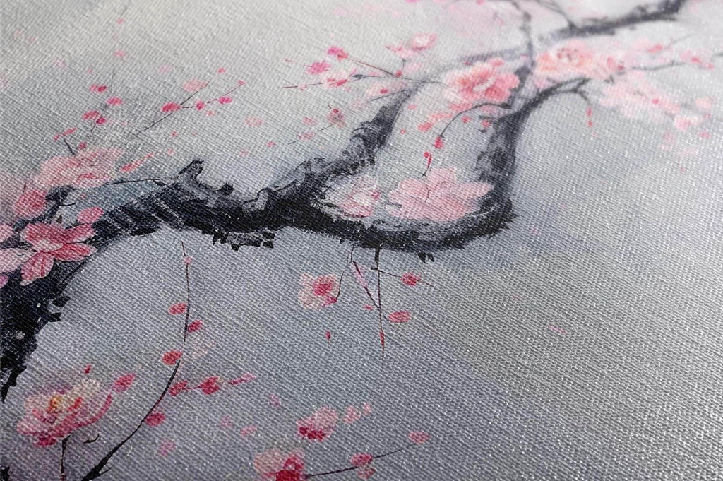 a close-up view of a branch with pink flowers, possibly cherry blossoms, against a gray background.