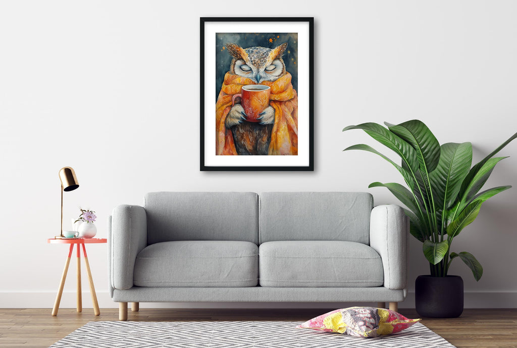 a gray sofa, a framed painting of an owl holding a cup, a small table with a lamp, and a potted plant, all set against a white wall.