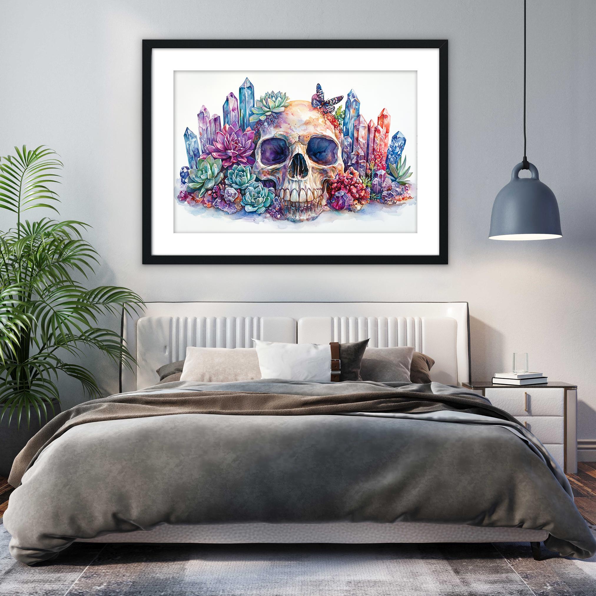 a bedroom with a large bed, a framed artwork of a skull surrounded by colorful crystals and plants, and a pendant light hanging above the bed.