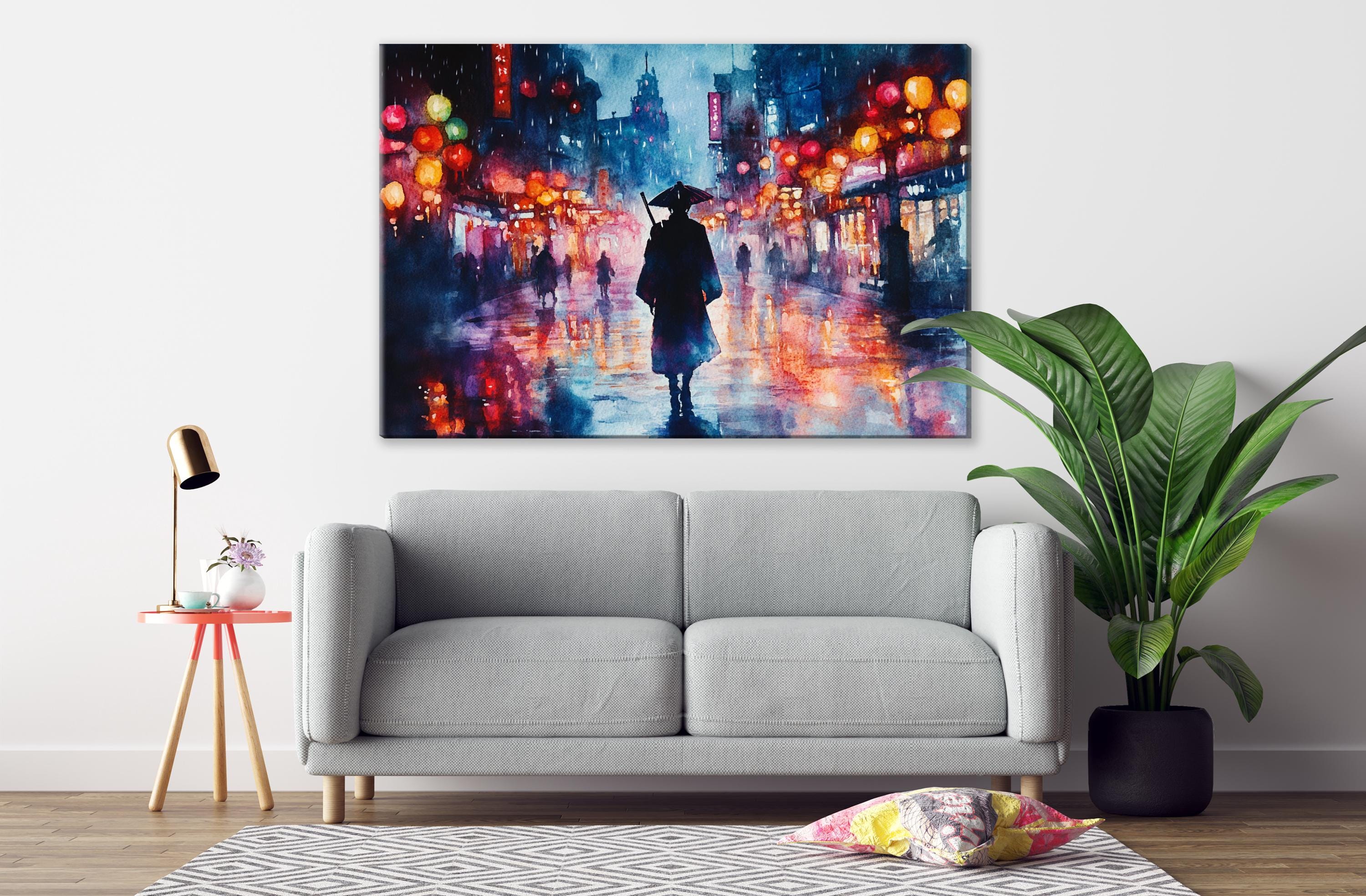 a gray sofa in a living room with a large painting of a city street scene hanging on the wall above it.