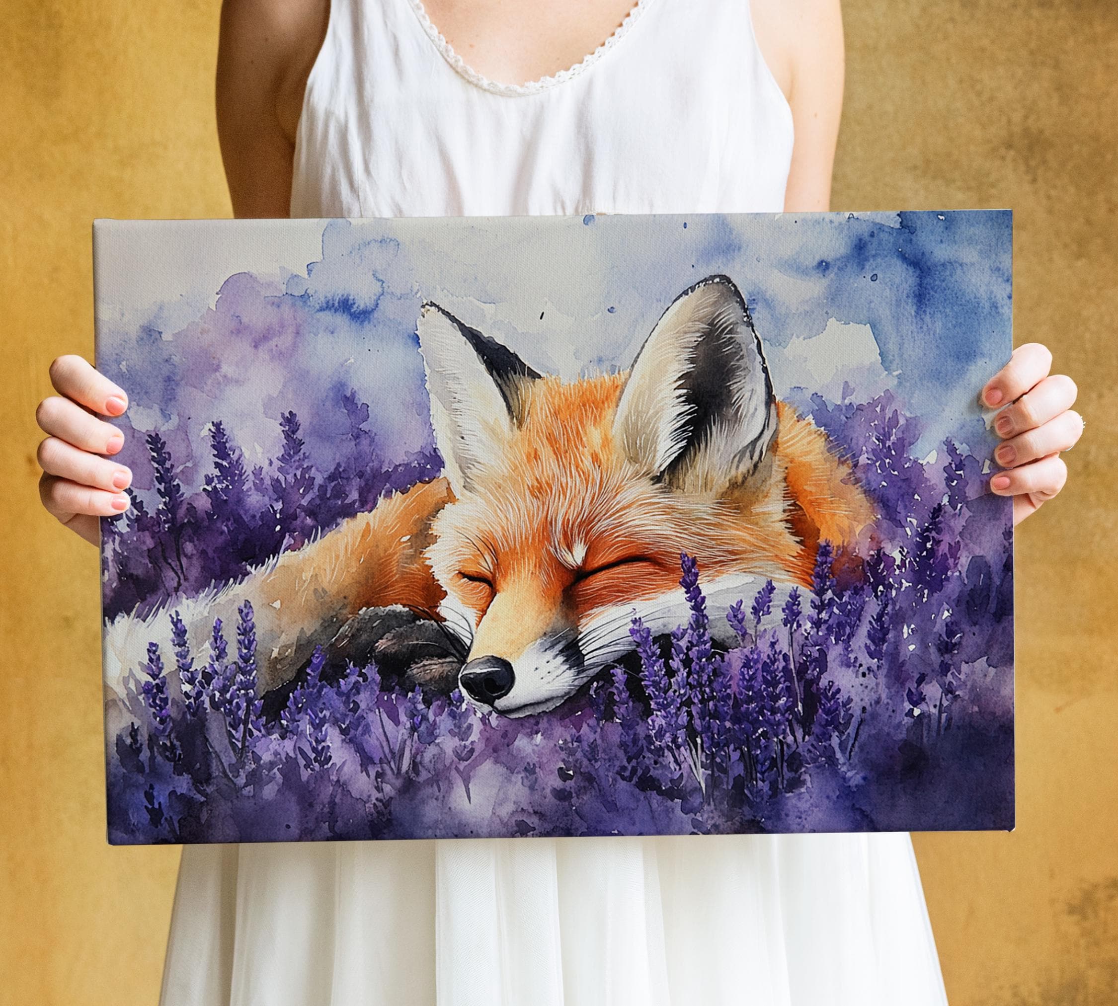 A person is holding a framed painting of a sleeping fox in a field of purple flowers.