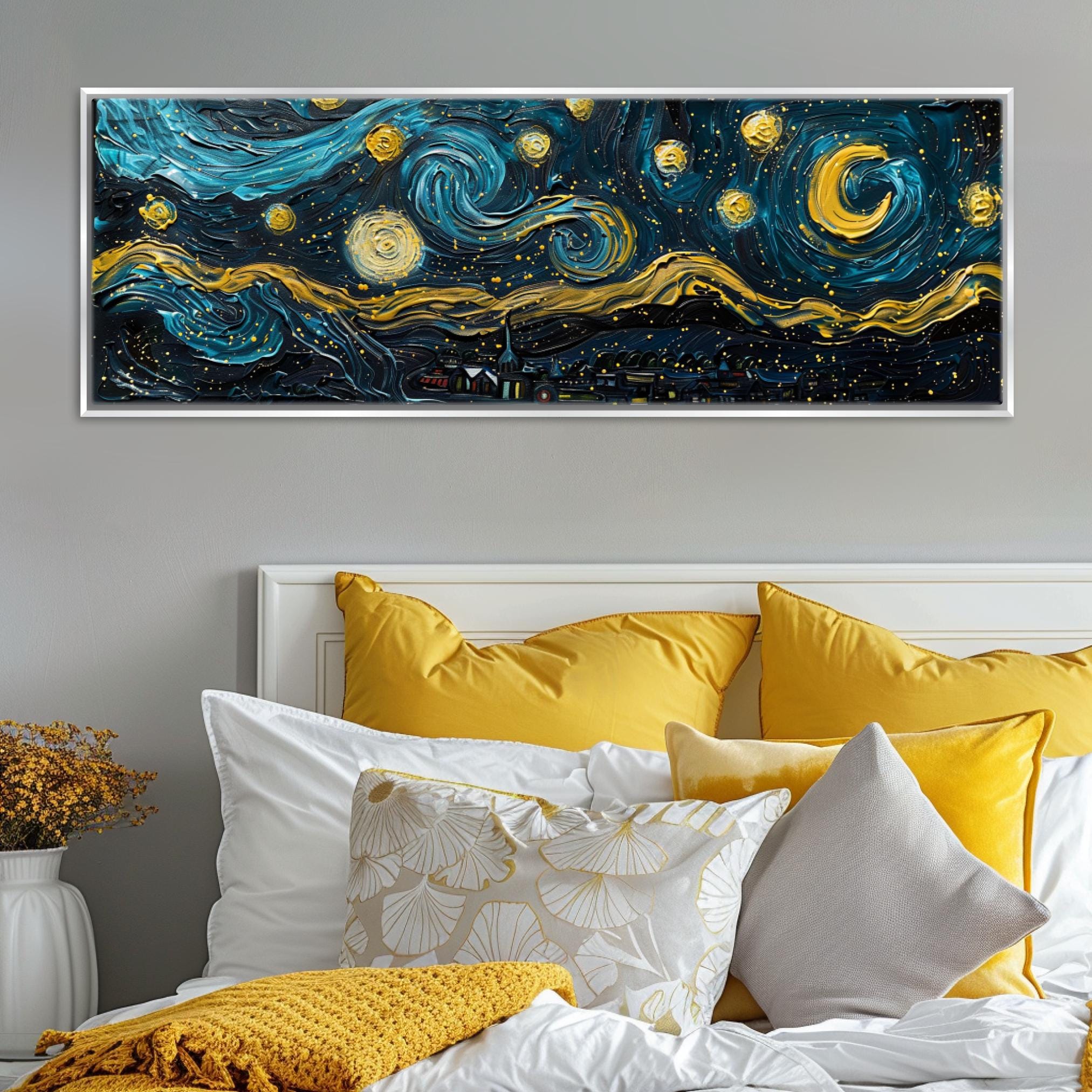 a bed with yellow pillows and a painting on the wall