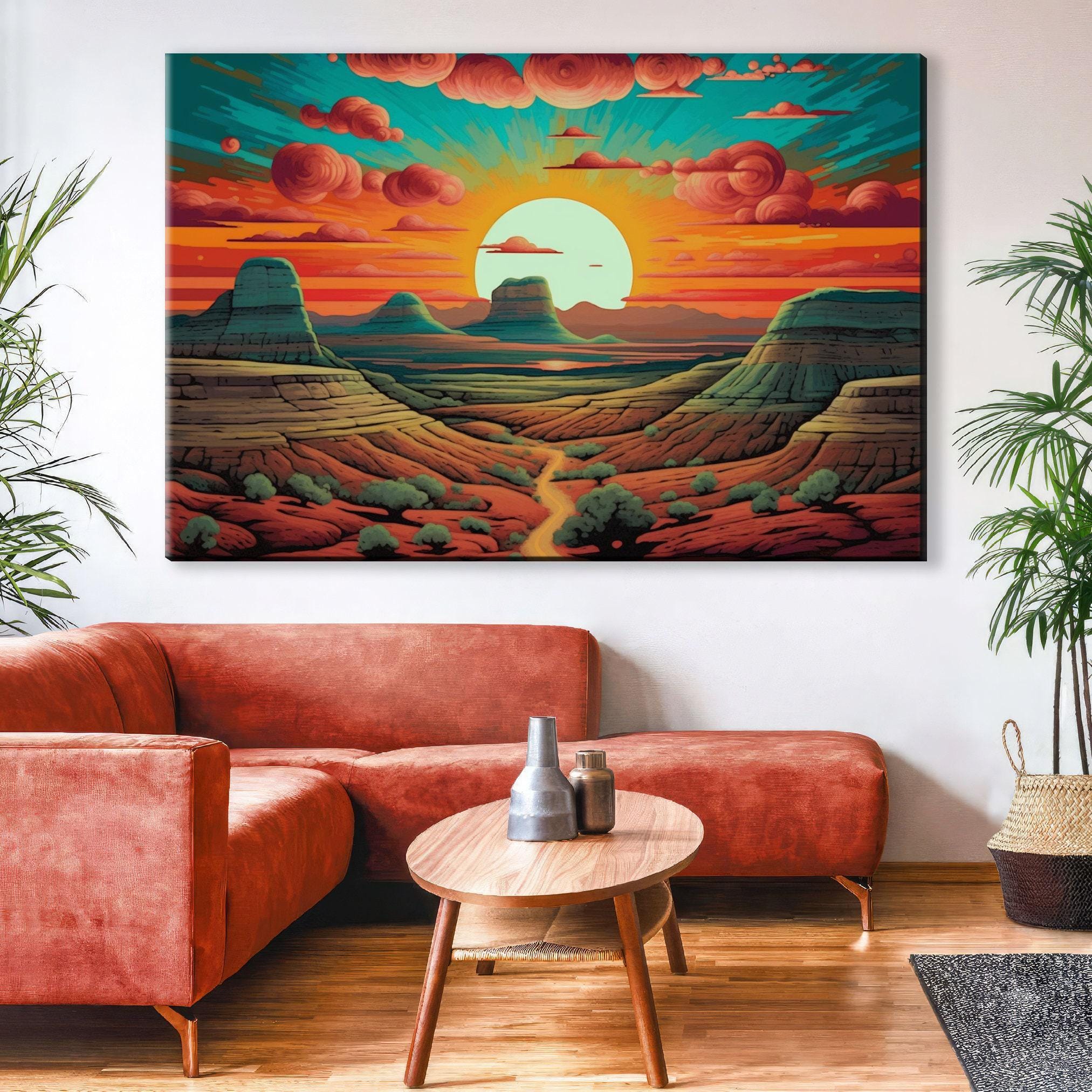 a large, colorful painting of a desert landscape with mountains, a sunset, and clouds, hanging on a wall above a red couch and a coffee table in a living room setting.