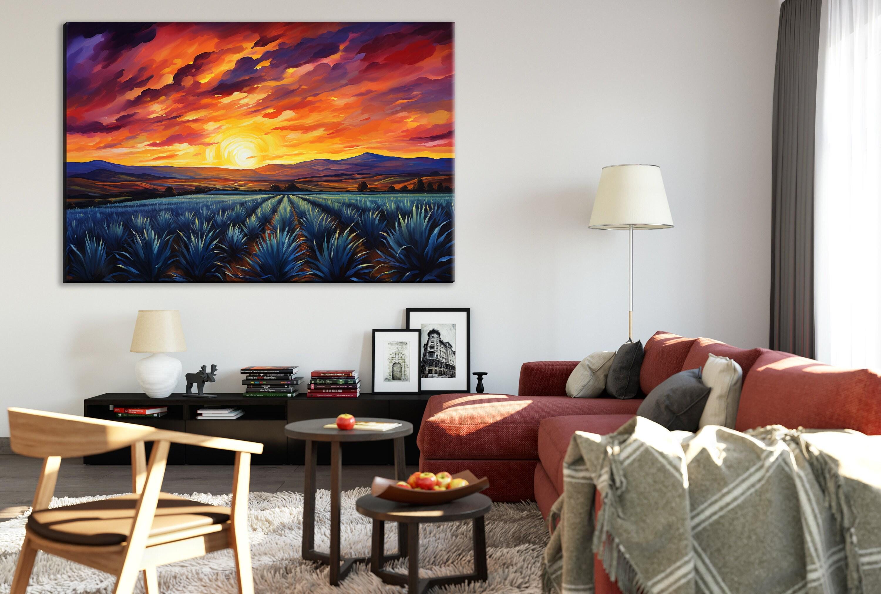 a cozy living room with a large painting of a sunset over a field of blue flowers hanging on the wall. The room is furnished with a red sofa, a wooden chair, and a coffee table with a bowl of fruit. The overall atmosphere of the room is warm and inviting, with the painting adding a touch of color and natural beauty to the space.