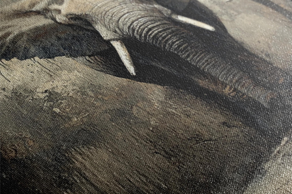 an elephant with tusks laying on the ground