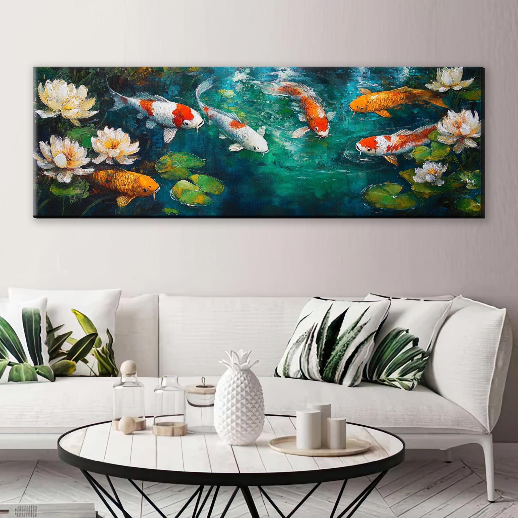 a living room with a white couch and a painting on the wall