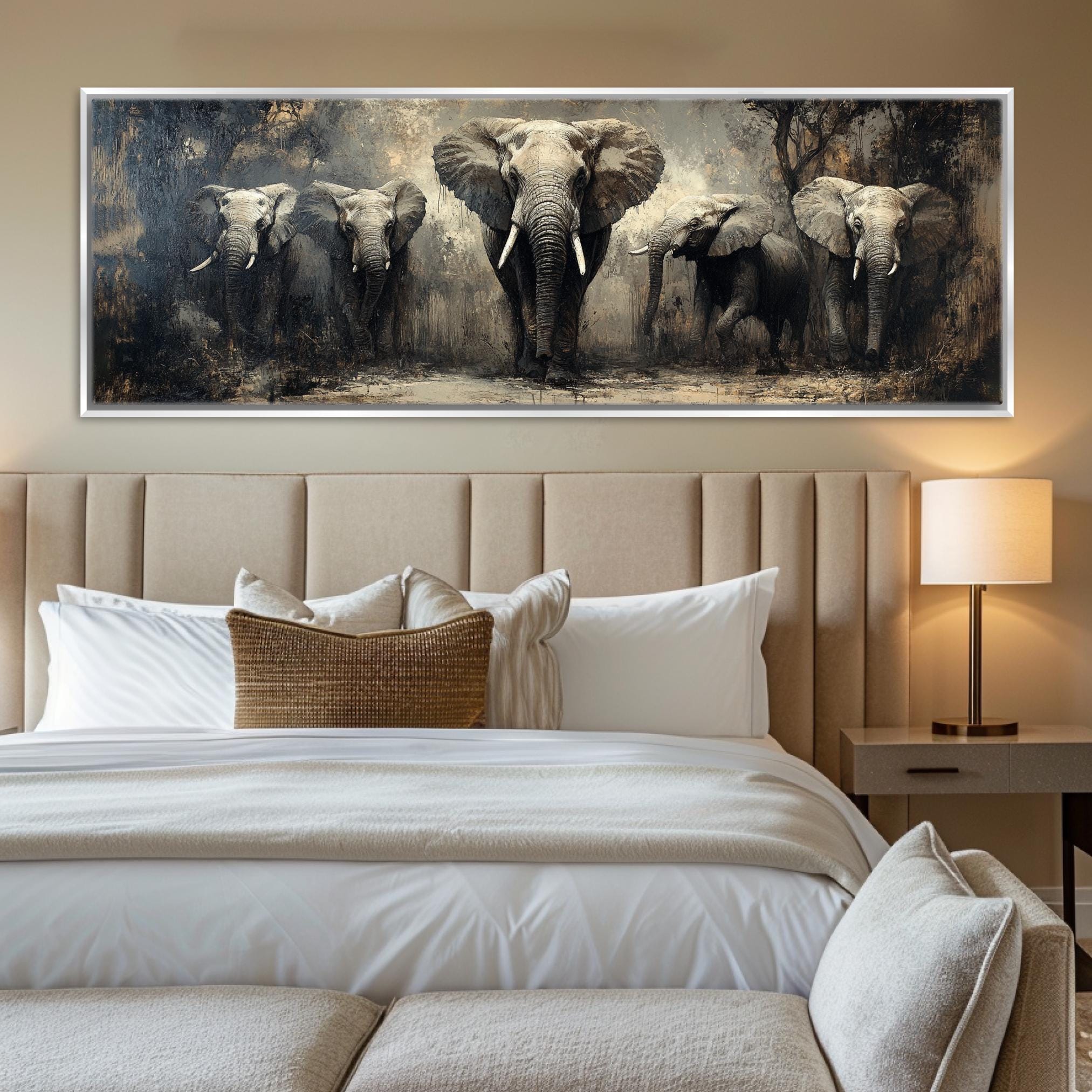 a picture of elephants on a wall above a bed