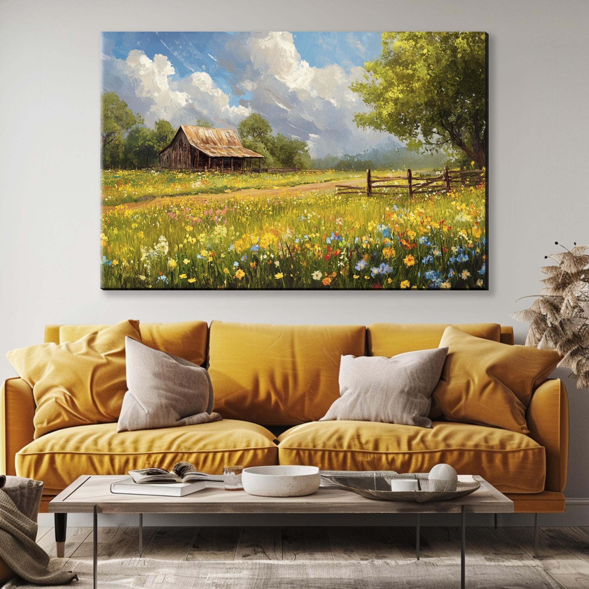 a living room with a couch and a painting on the wall