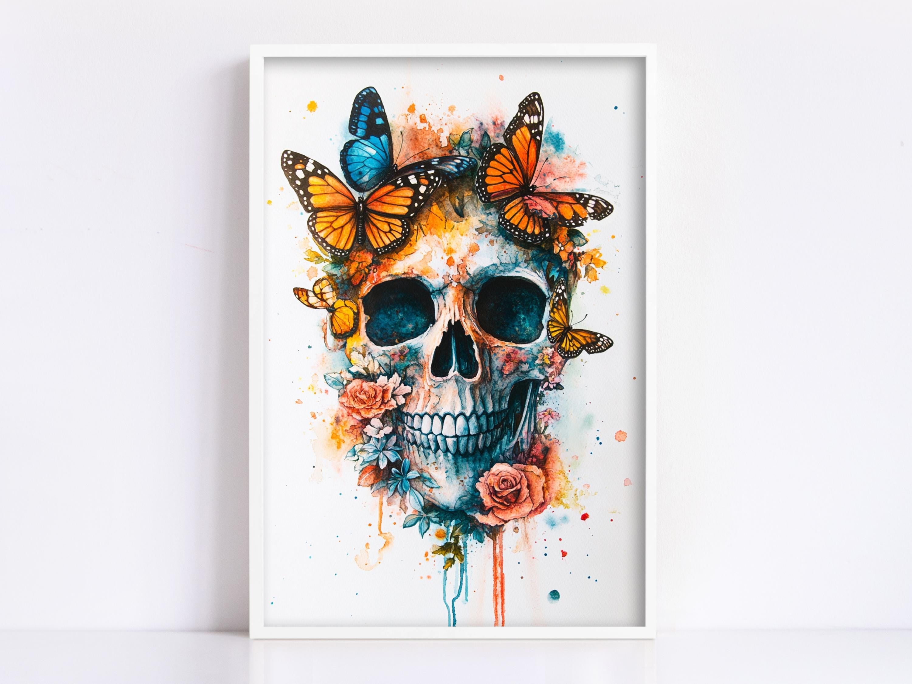 The image is a framed artwork depicting a skull surrounded by butterflies and flowers, creating a vibrant and colorful composition.