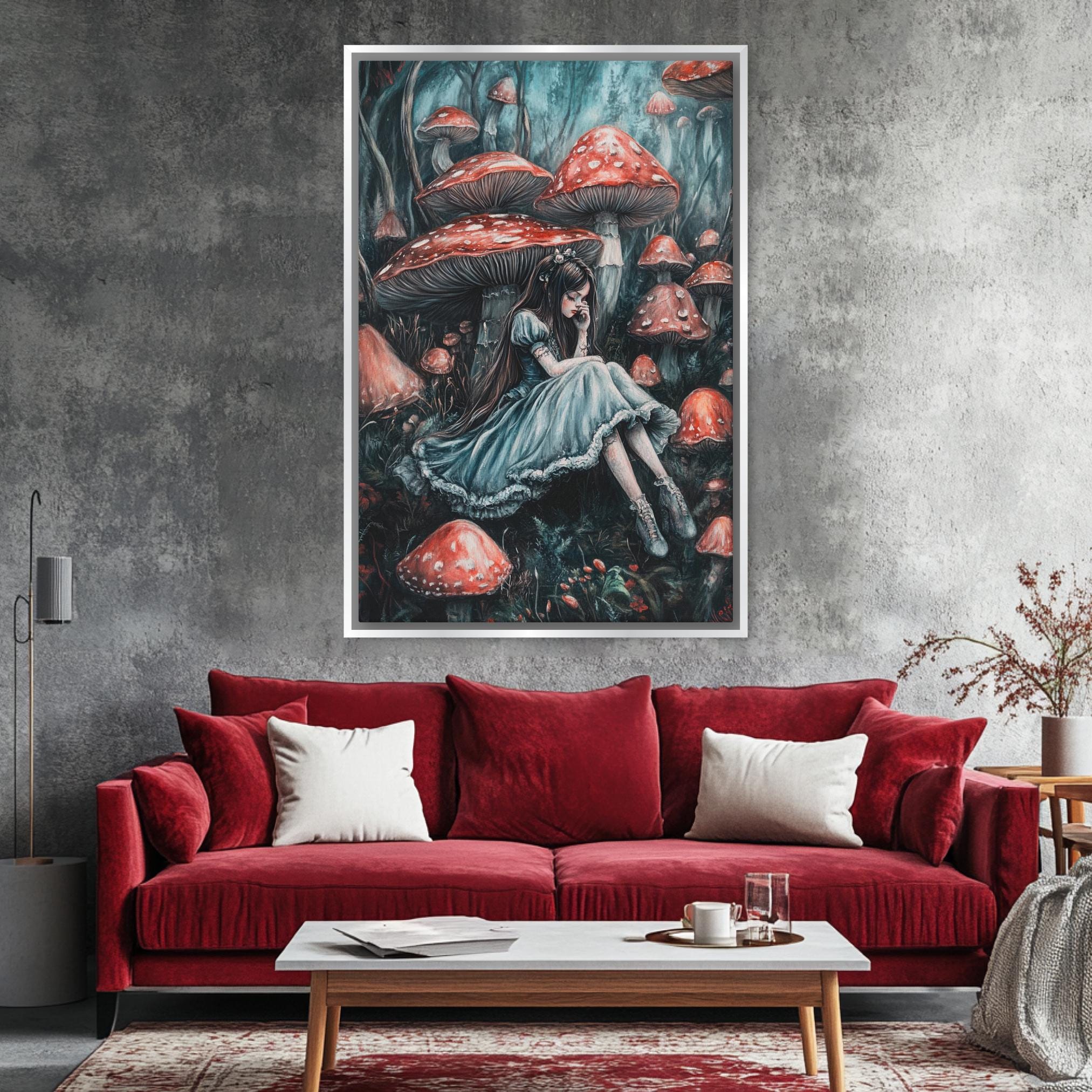 a living room with a red couch and a painting on the wall