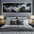 a bedroom with a large painting on the wall above the bed