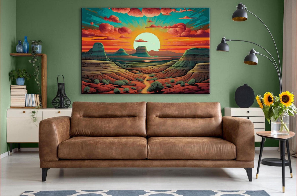 a large, colorful painting of a desert landscape hanging on a wall in a living room. The painting depicts a desert scene with mountains, a sunset, and a winding path. The room has a brown leather couch, a side table with a vase of flowers, and a bookshelf with various items.