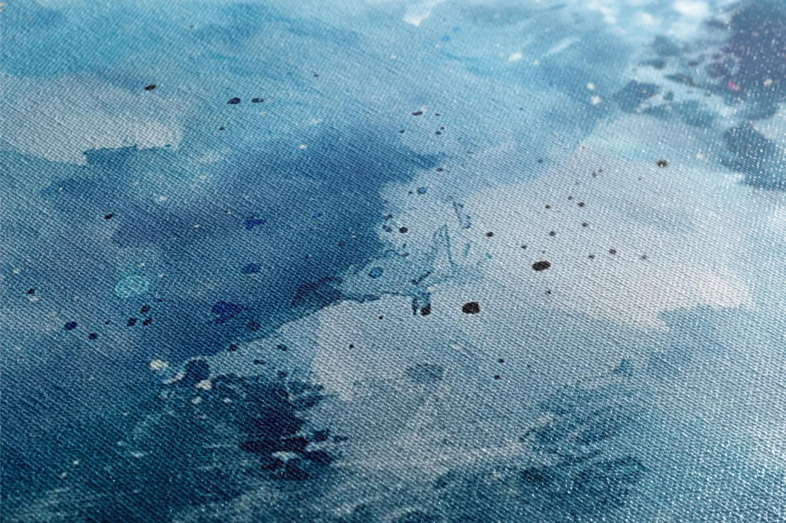 a close up of a painting with blue and white colors