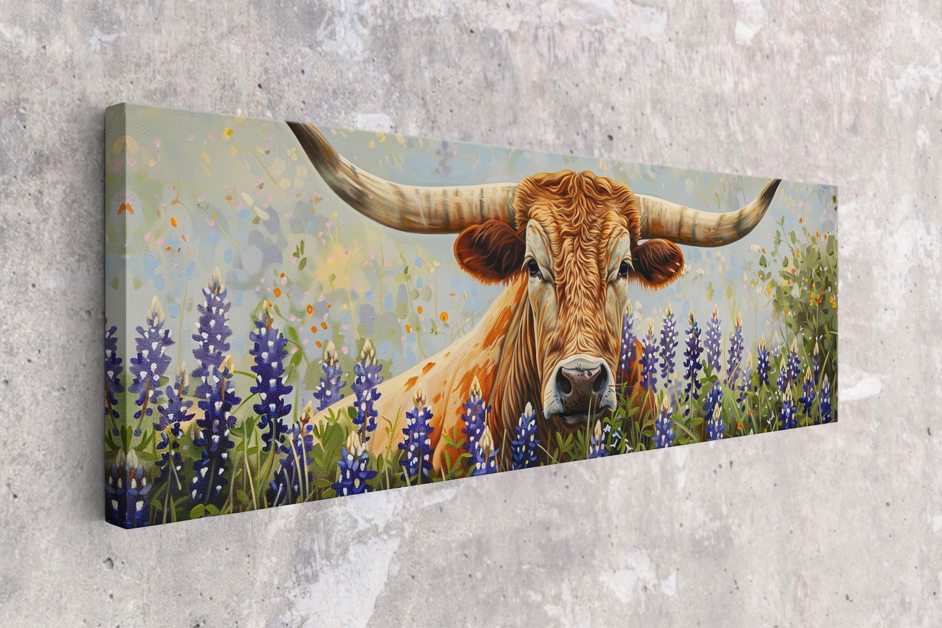A large, horned bull with long, curved horns stands in a field of purple flowers, surrounded by a lush, green landscape.