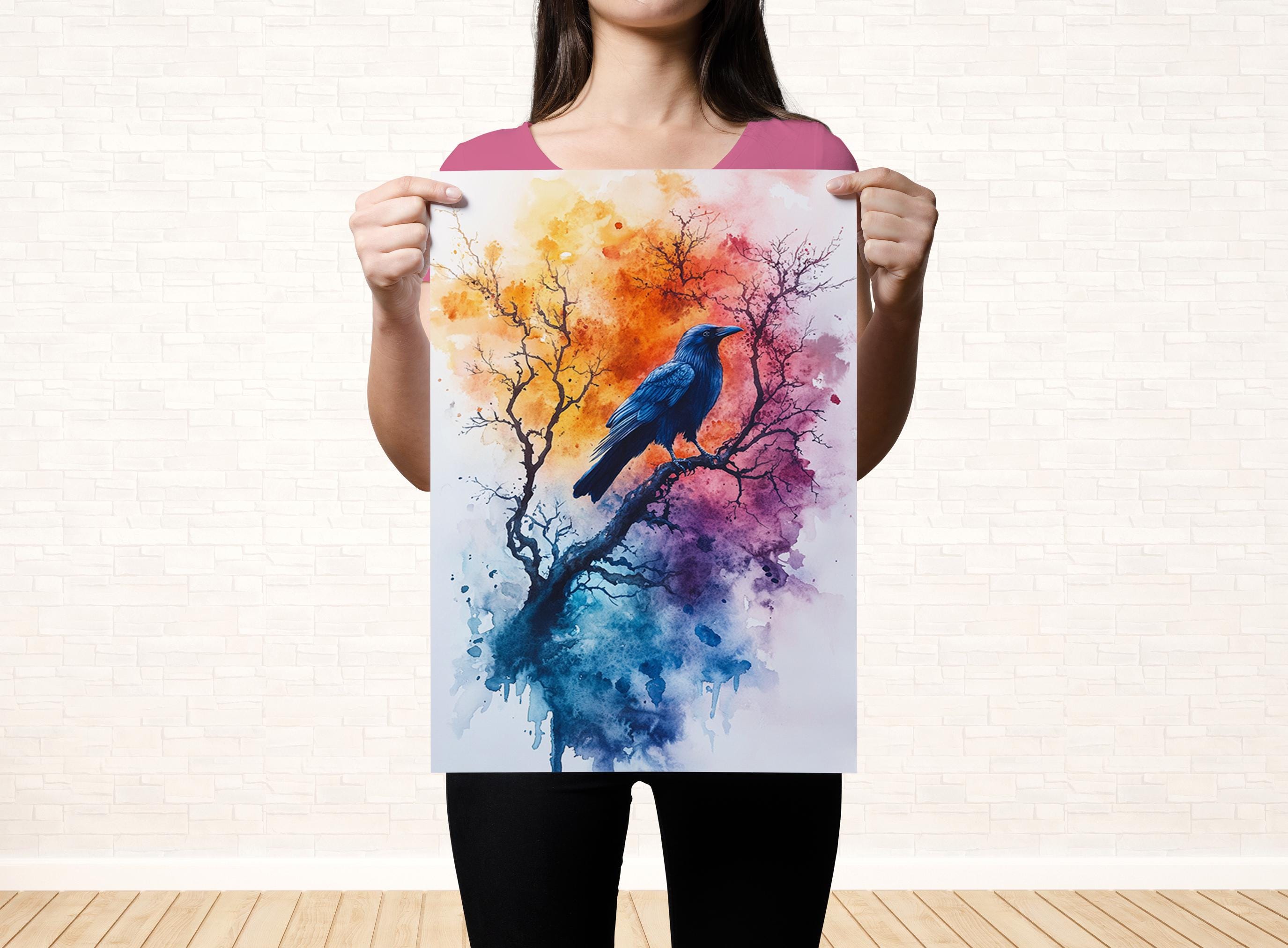 A woman holds up a colorful painting of a bird perched on a tree branch, with vibrant orange, yellow, and purple hues.