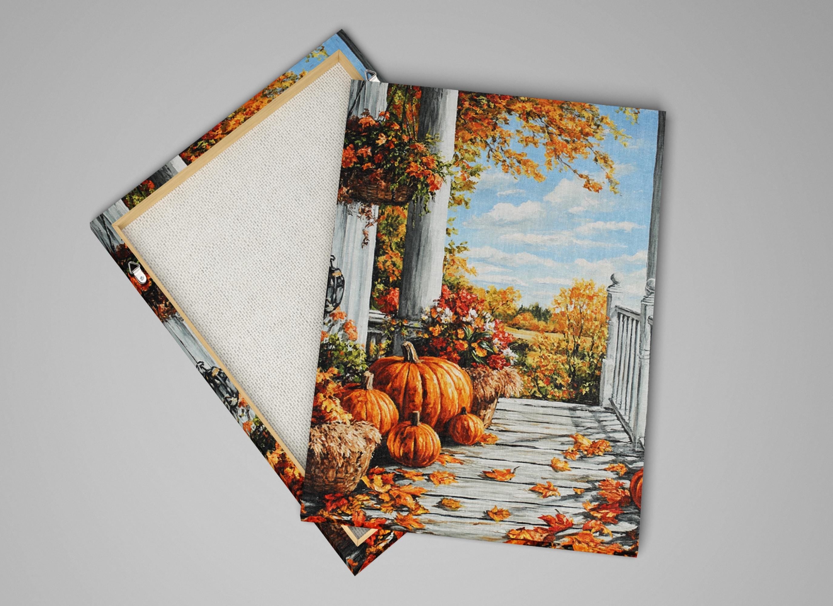 a porch with a white railing and a wooden floor, surrounded by pumpkins and autumn leaves.