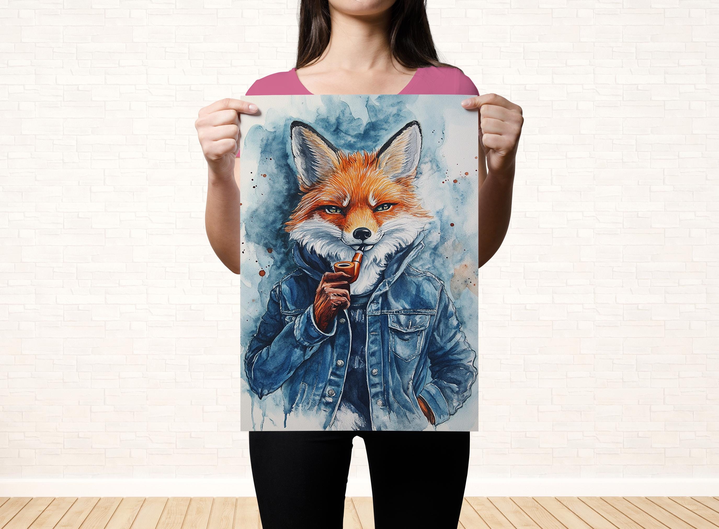 A woman is holding up a poster featuring a painting of a fox wearing a denim jacket.