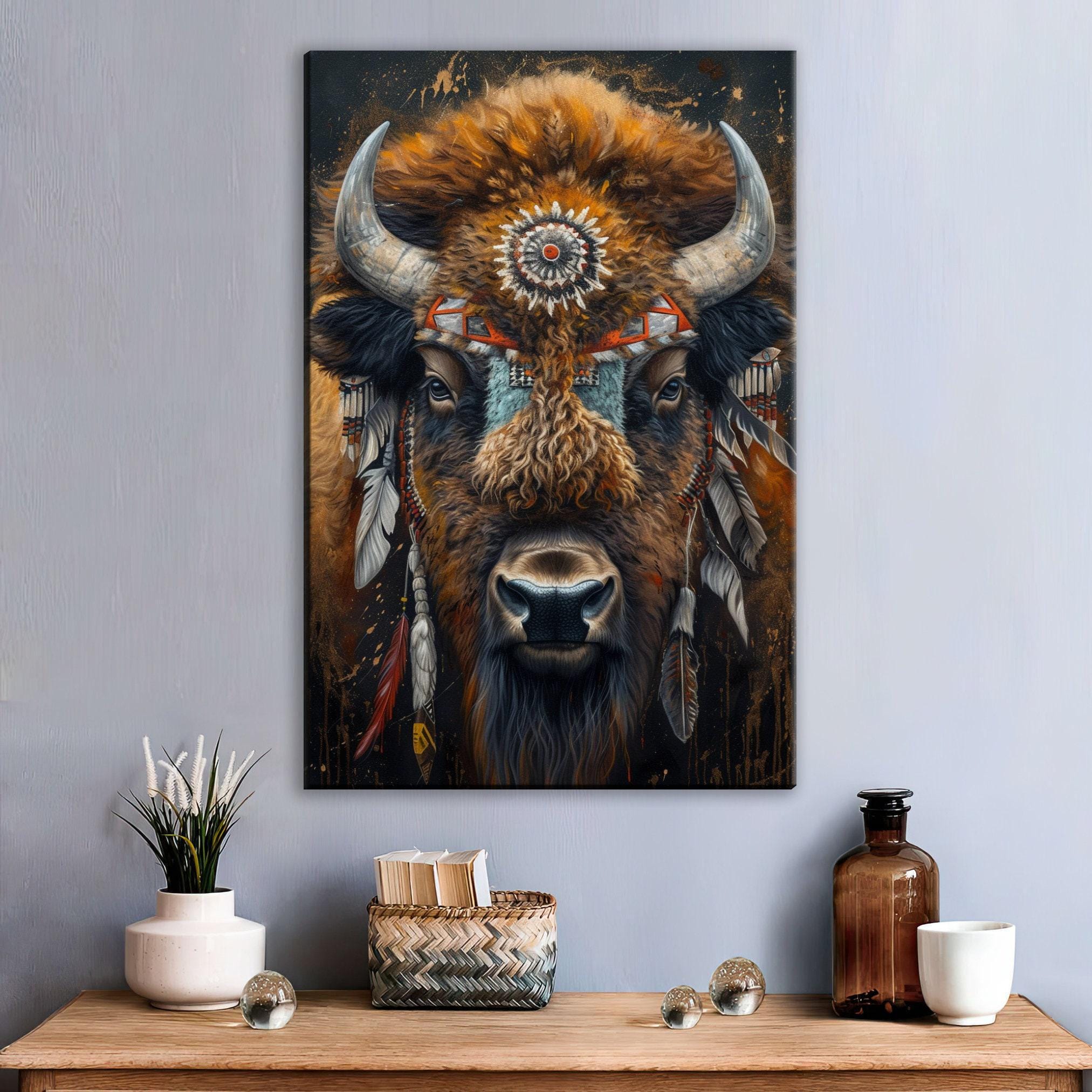 a large painting of a buffalo with a decorative headdress, displayed on a wall above a wooden table with various decorative items.