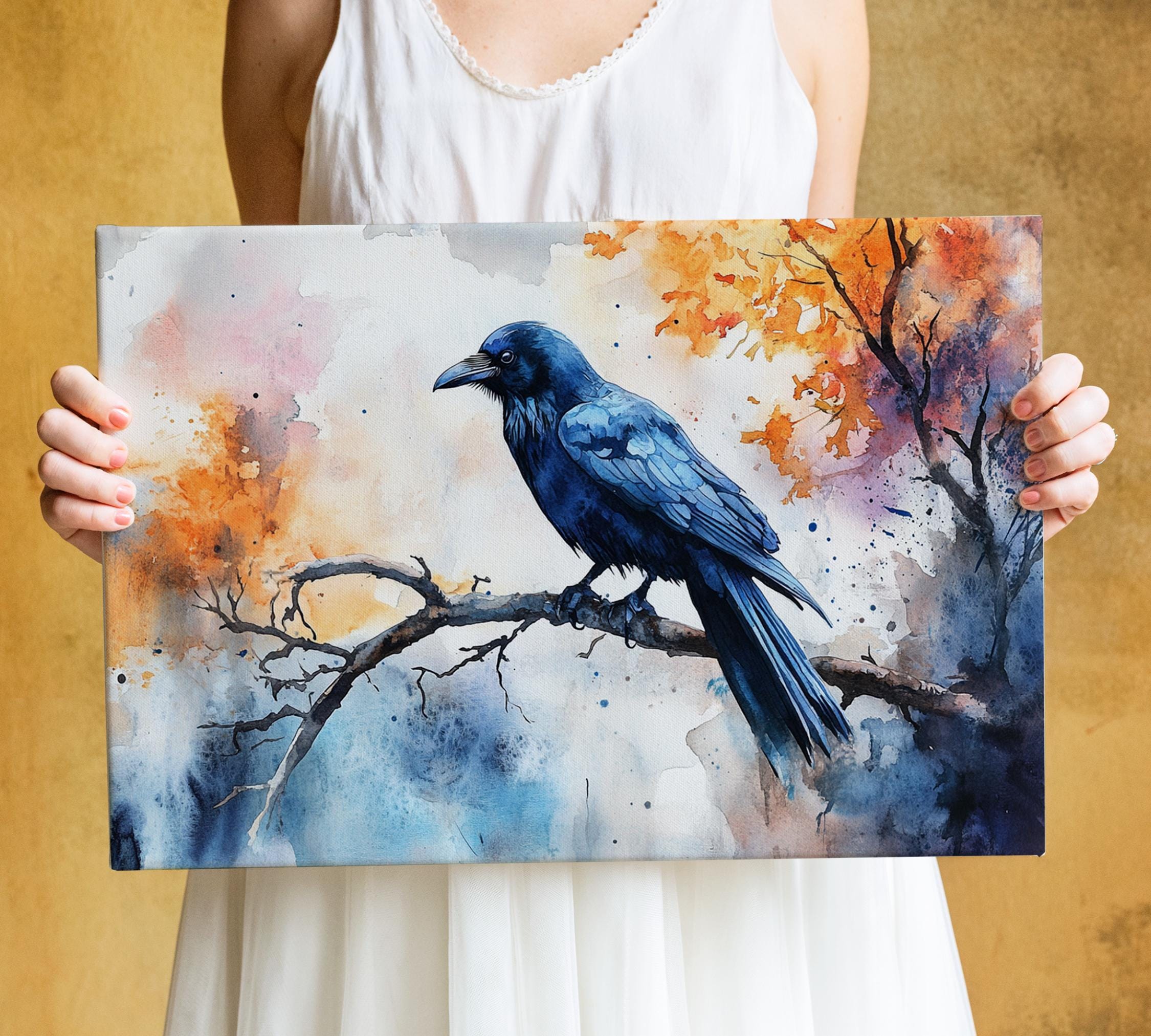 A person is holding a framed painting of a blue bird perched on a branch, with autumn foliage in the background.