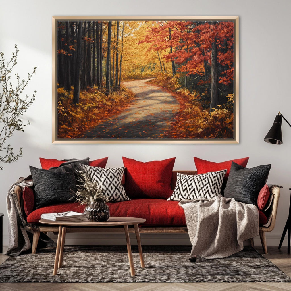 a cozy living room with a large, vibrant painting of a forest path in autumn hanging on the wall above a red sofa with patterned throw pillows.
