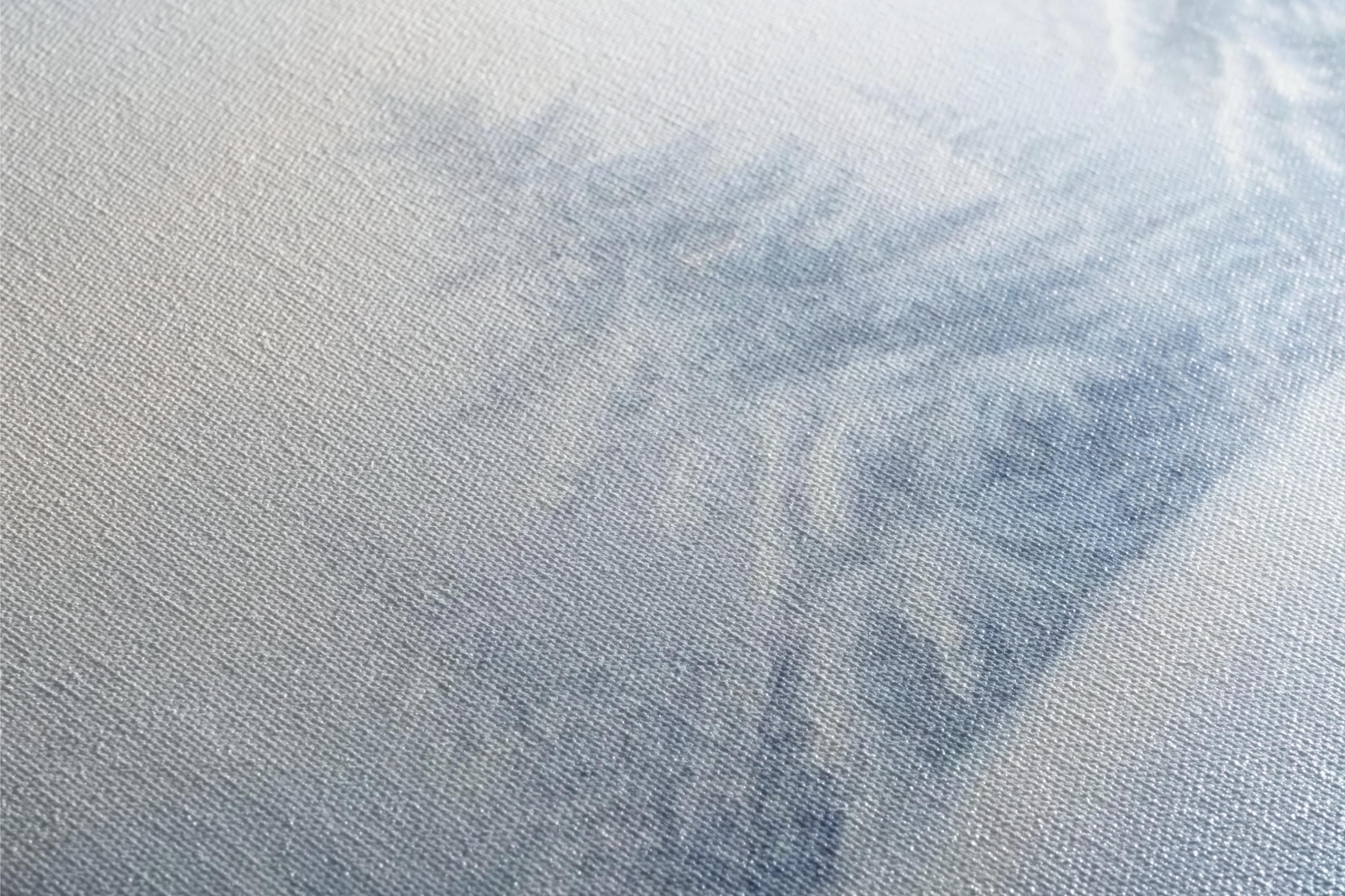 a close up of a white cloth with a blue background