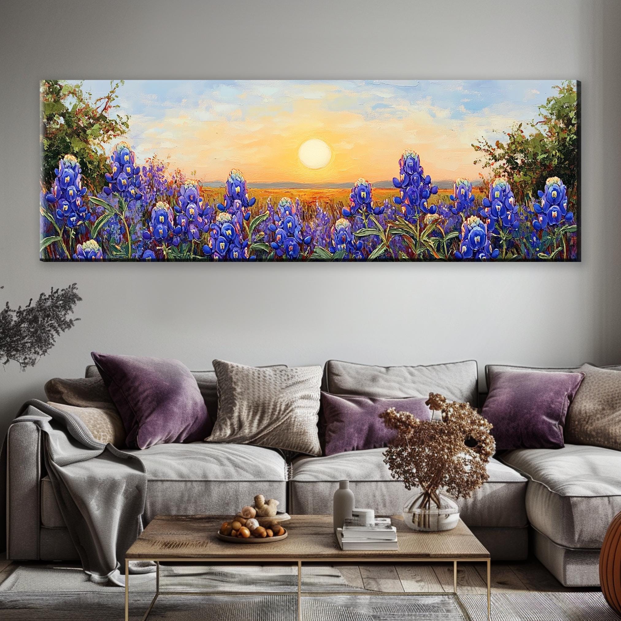 a living room with a couch and a painting on the wall