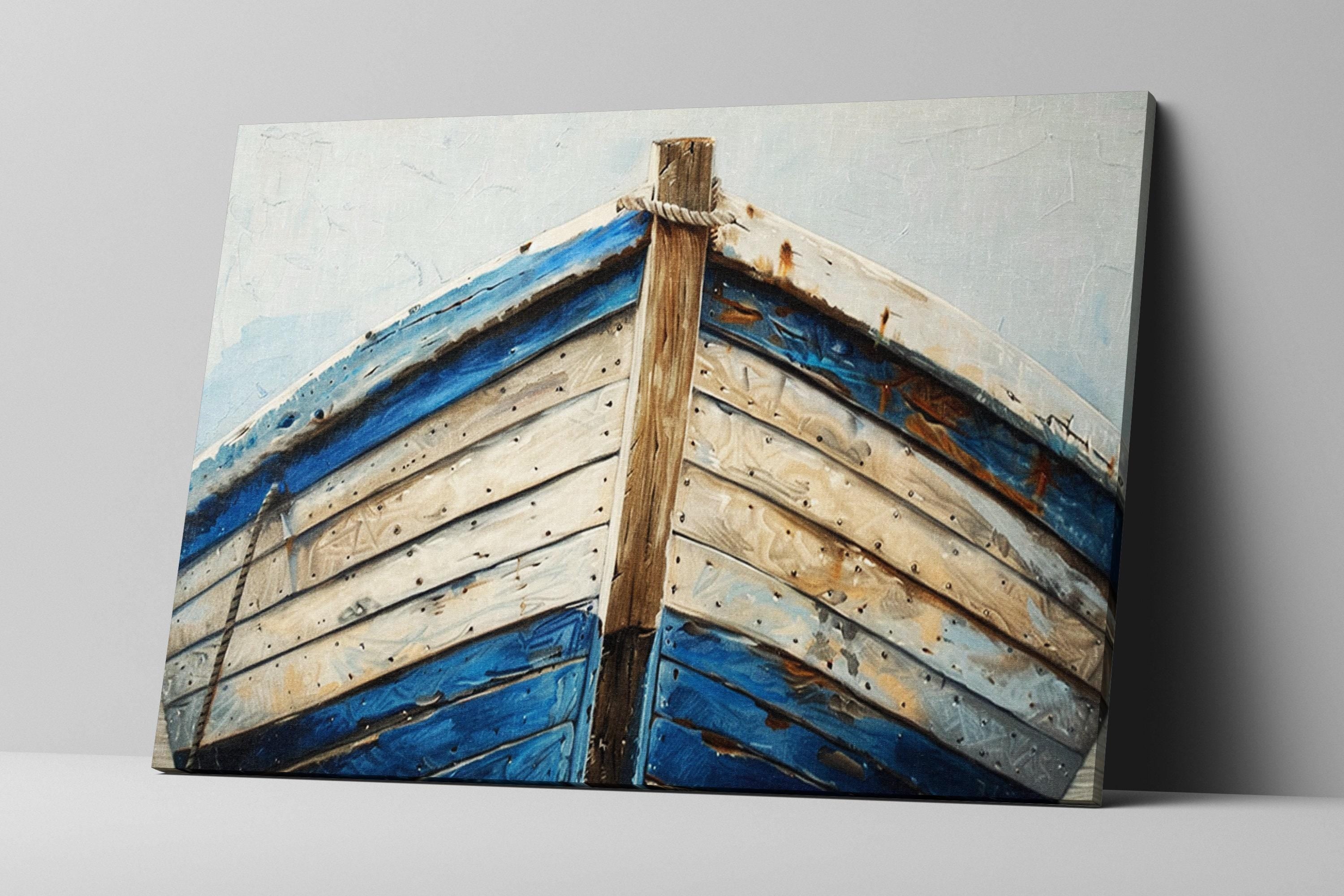 a wooden boat with blue and white colors, showing signs of wear and tear.