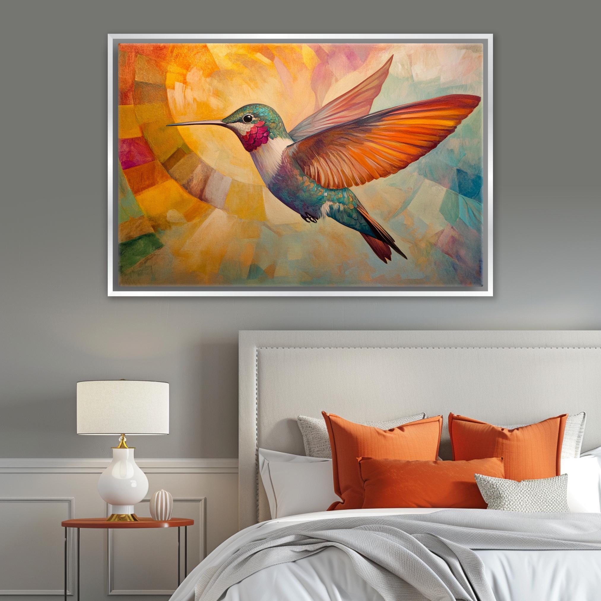 a painting of a hummingbird on a wall above a bed