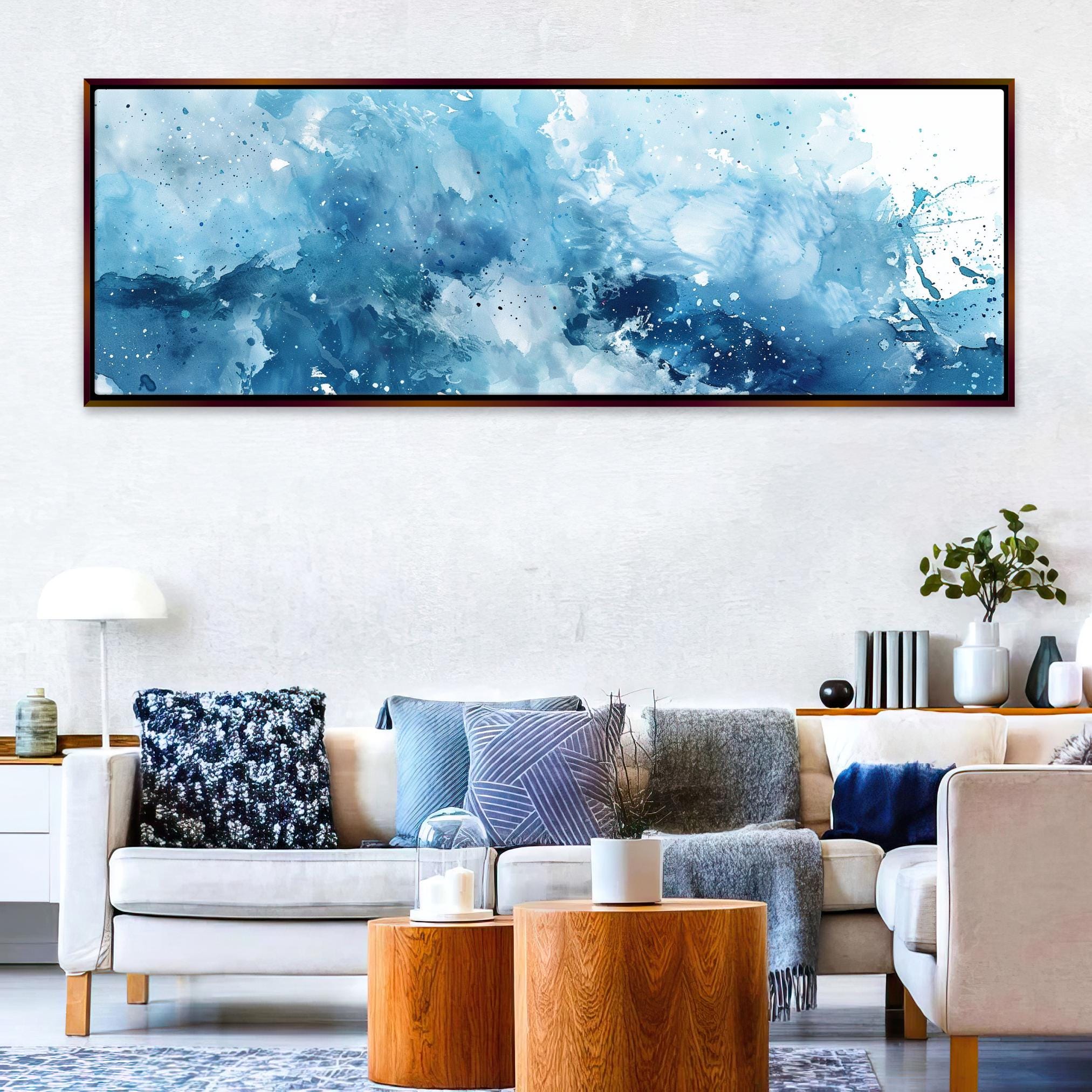 a living room filled with furniture and a painting on the wall