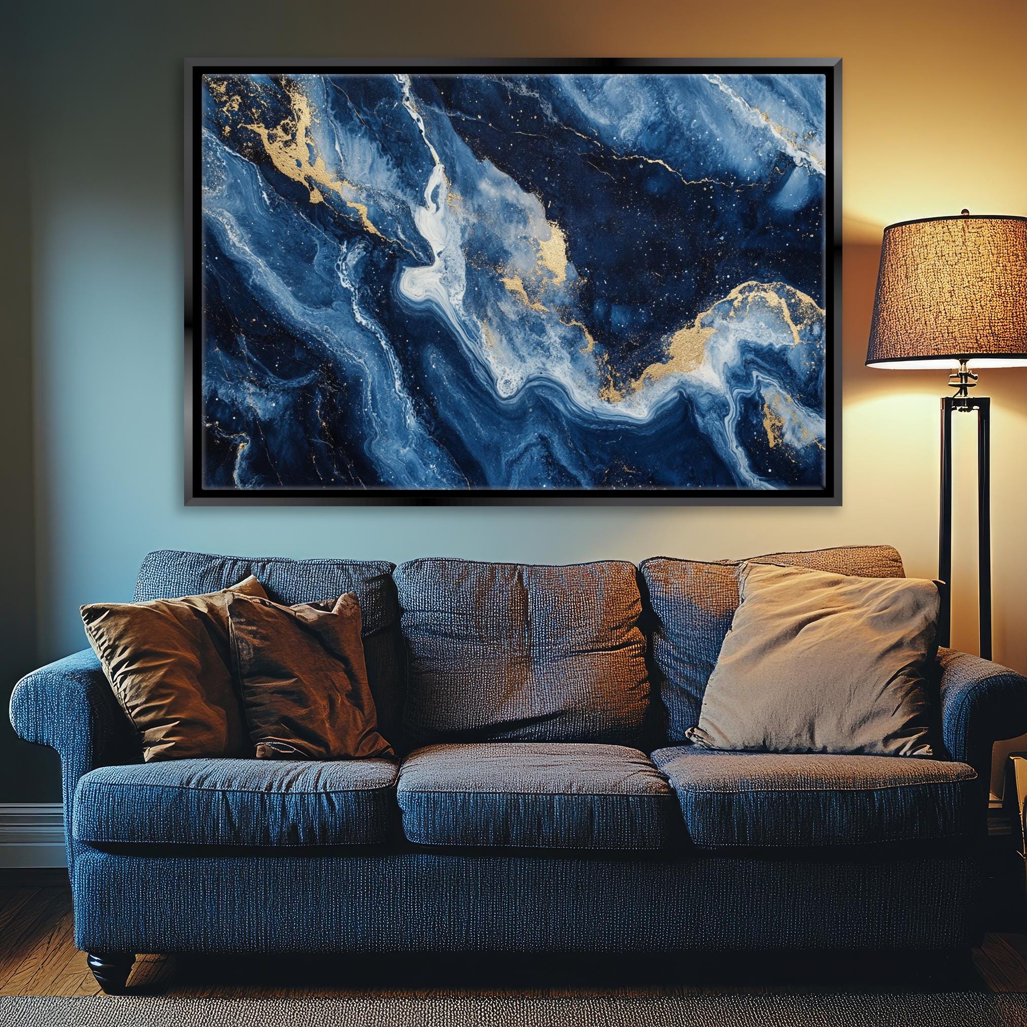 a living room with a couch and a painting on the wall