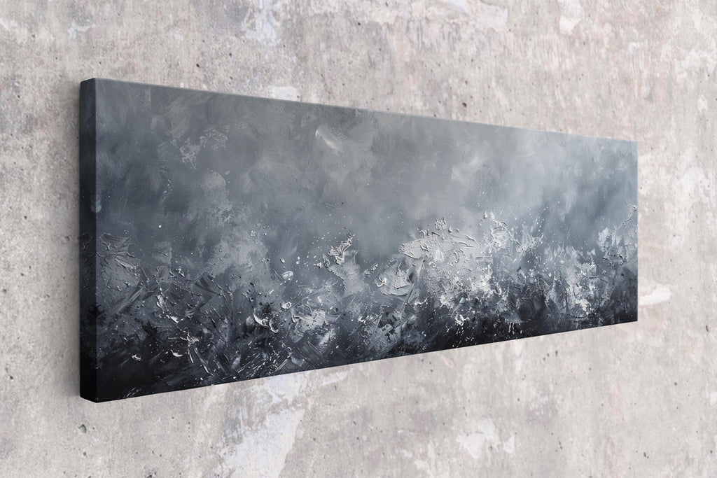a black and white painting hanging on a wall