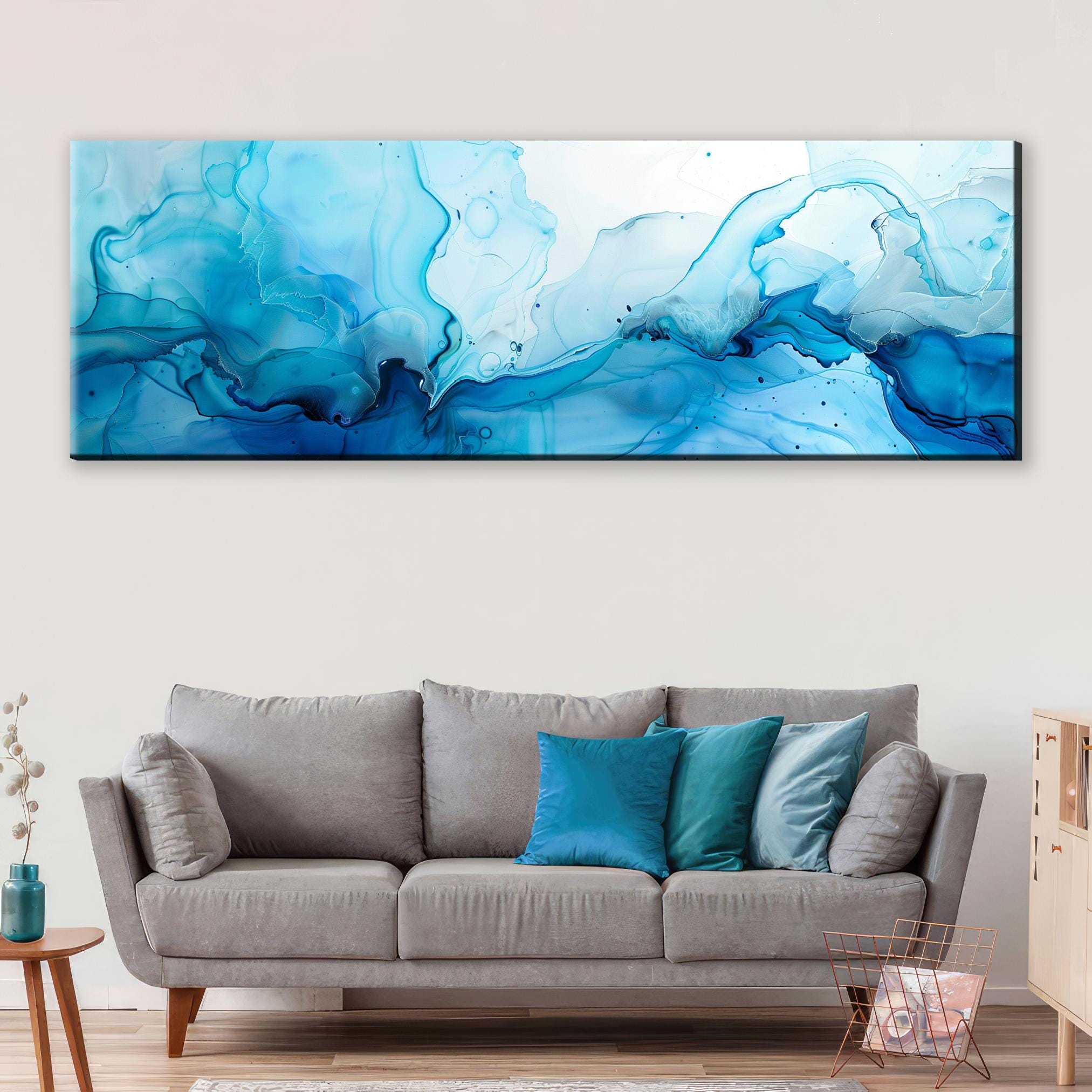 a living room with a couch and a painting on the wall