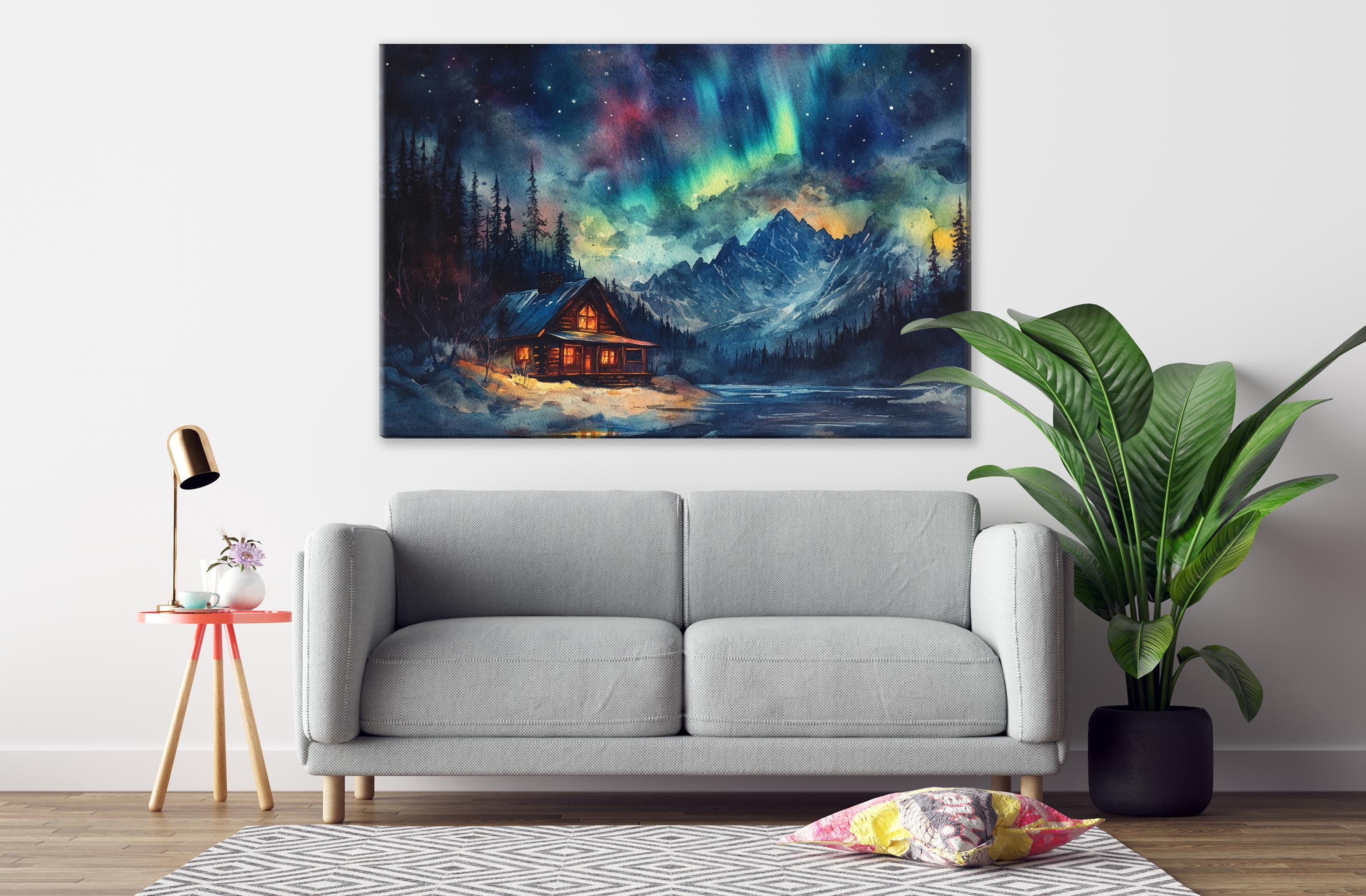 a cozy living room with a gray sofa, a wooden side table with a lamp, and a large painting of a cabin in the background, depicting a serene mountain landscape under a starry night sky.