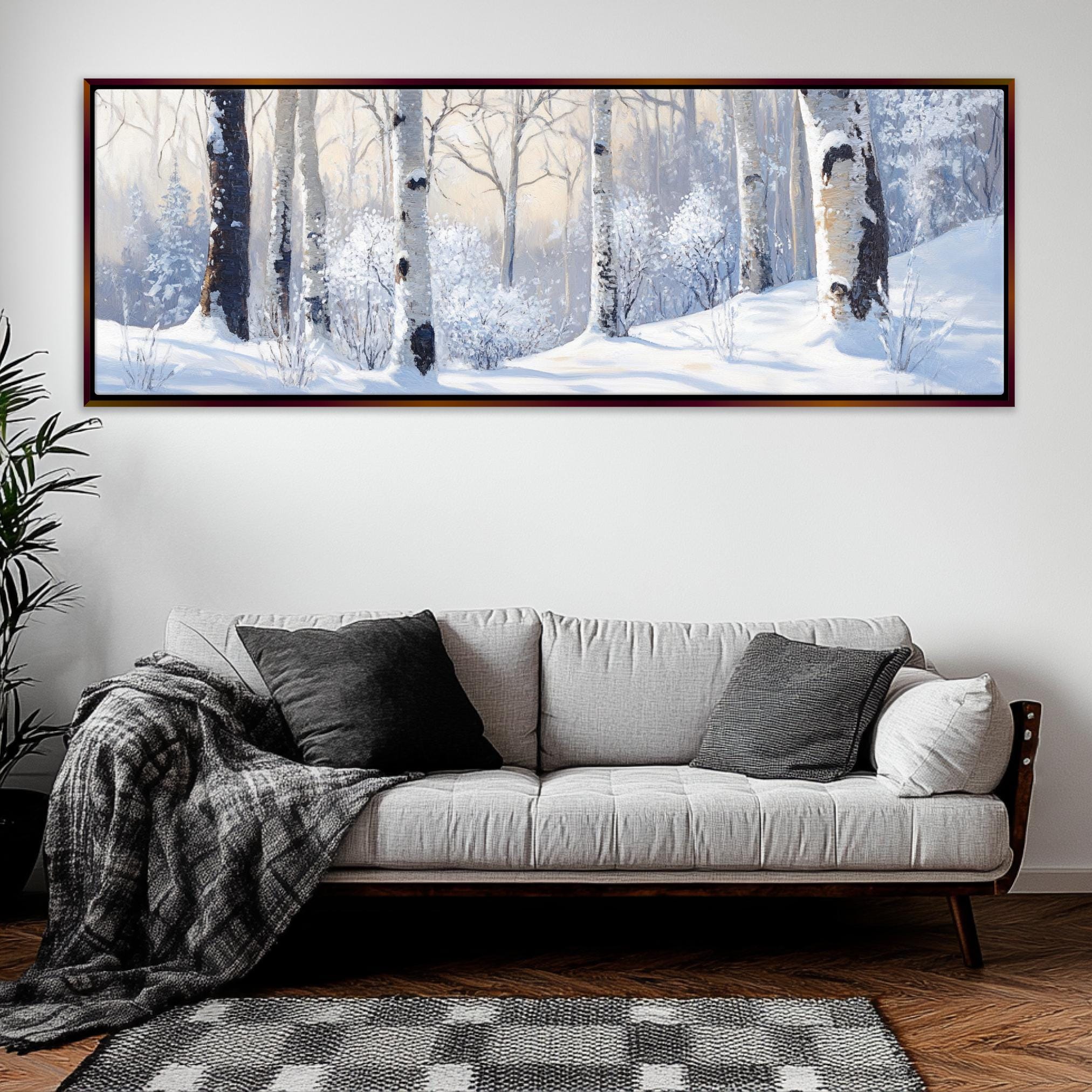 a living room with a couch and a painting on the wall