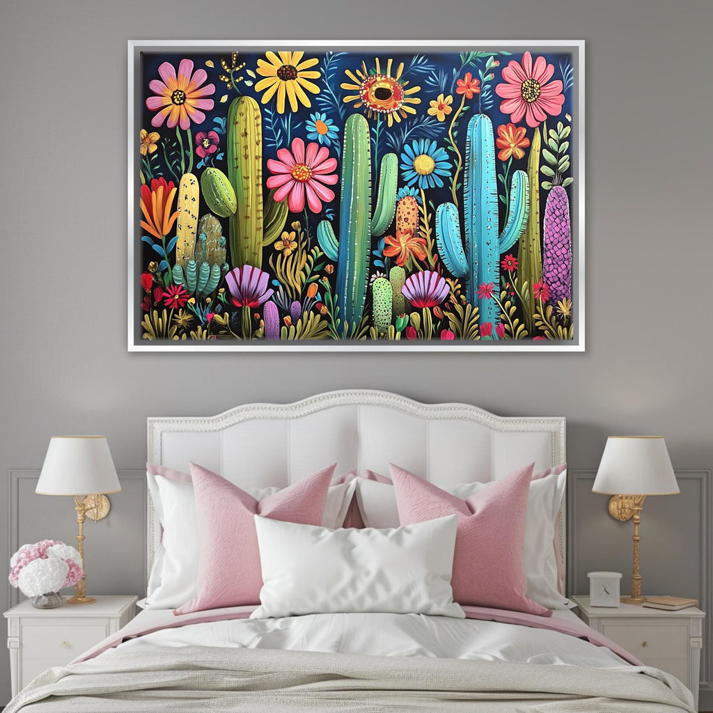 a painting of a cactus and flowers on a wall above a bed