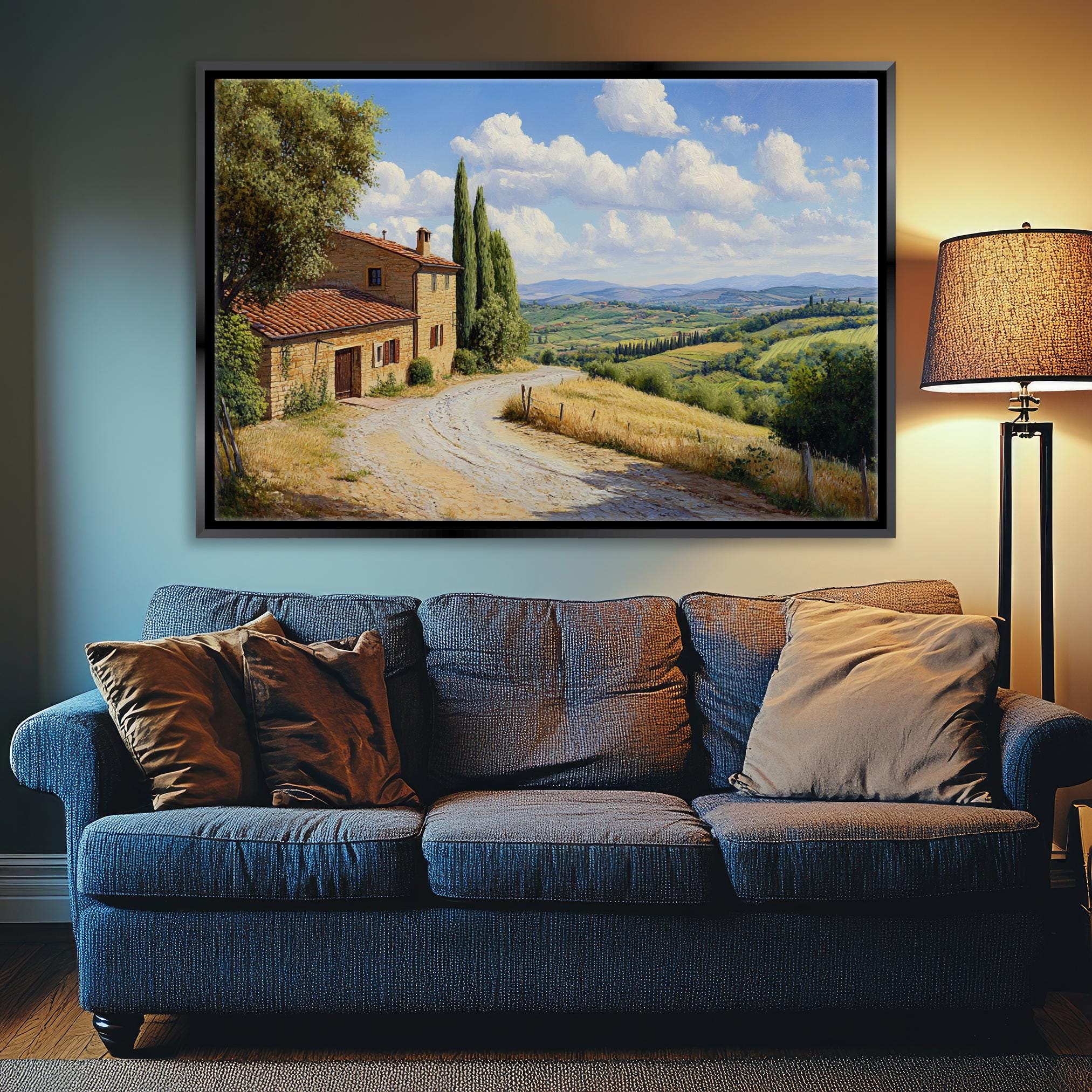 a living room with a couch and a painting on the wall