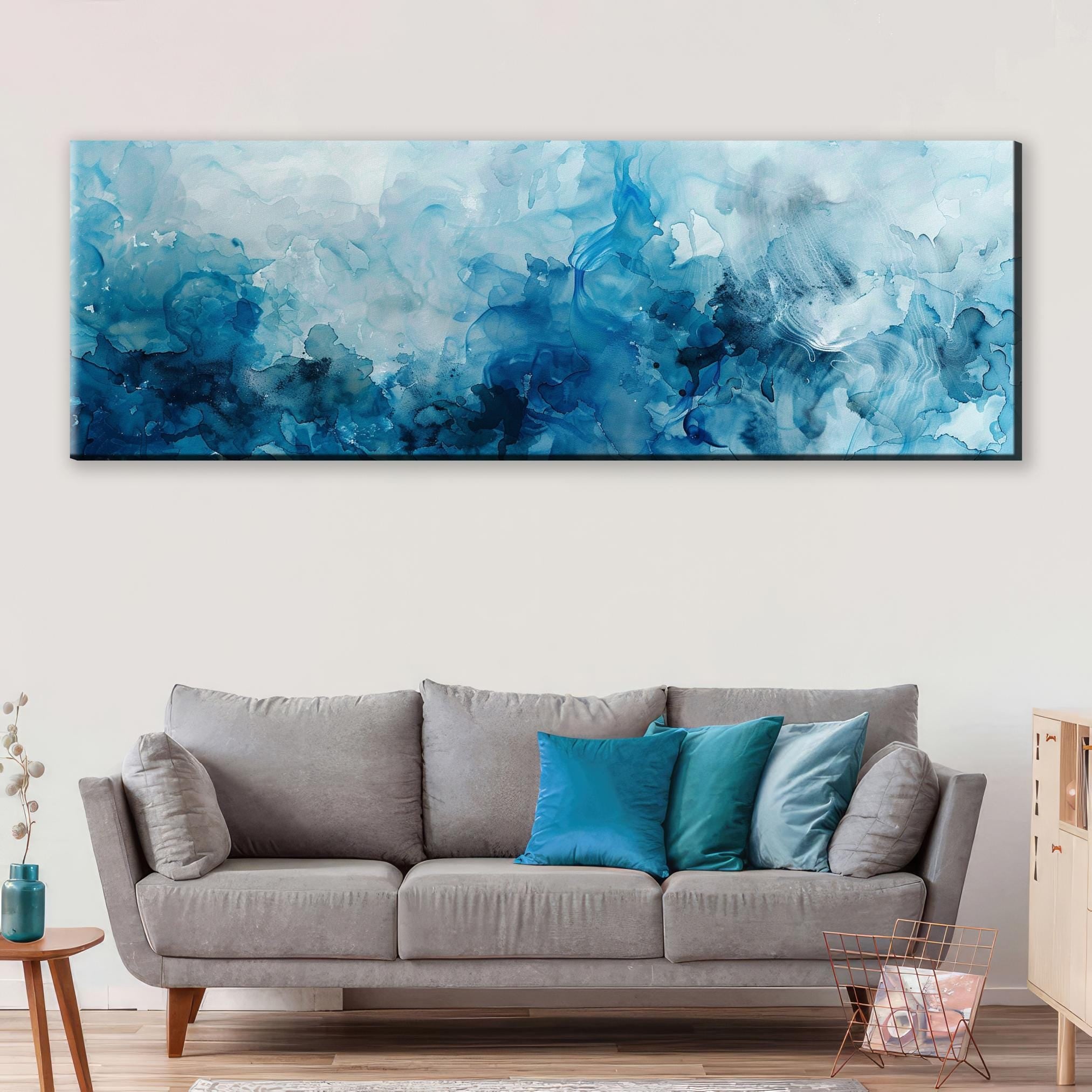a living room with a couch and a painting on the wall