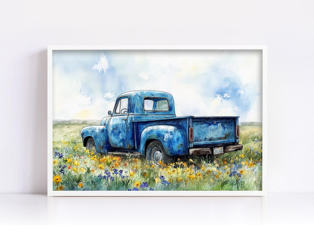 A blue vintage truck is parked in a field of wildflowers, with a cloudy sky in the background.