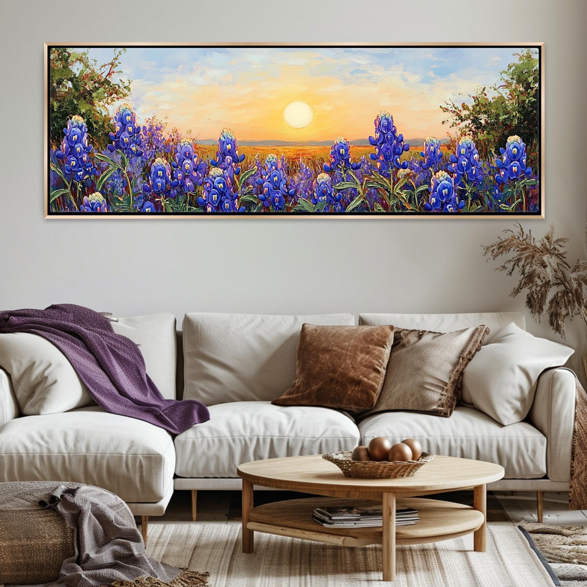 a living room with a couch and a painting on the wall