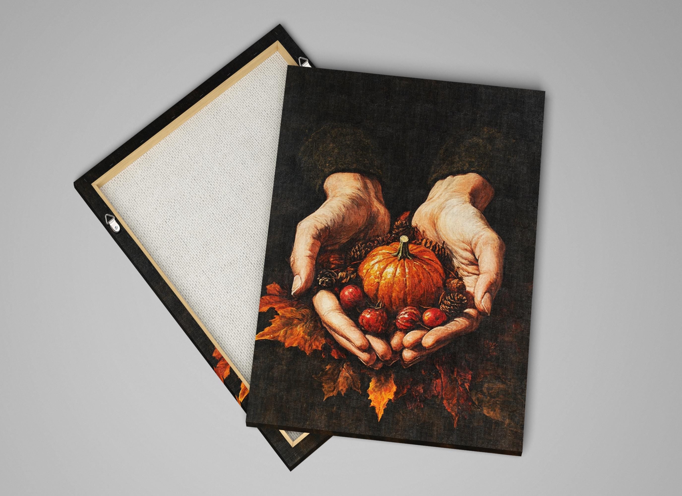 a pair of hands holding a pumpkin and other autumn-themed items, such as leaves and pine cones, against a dark background.