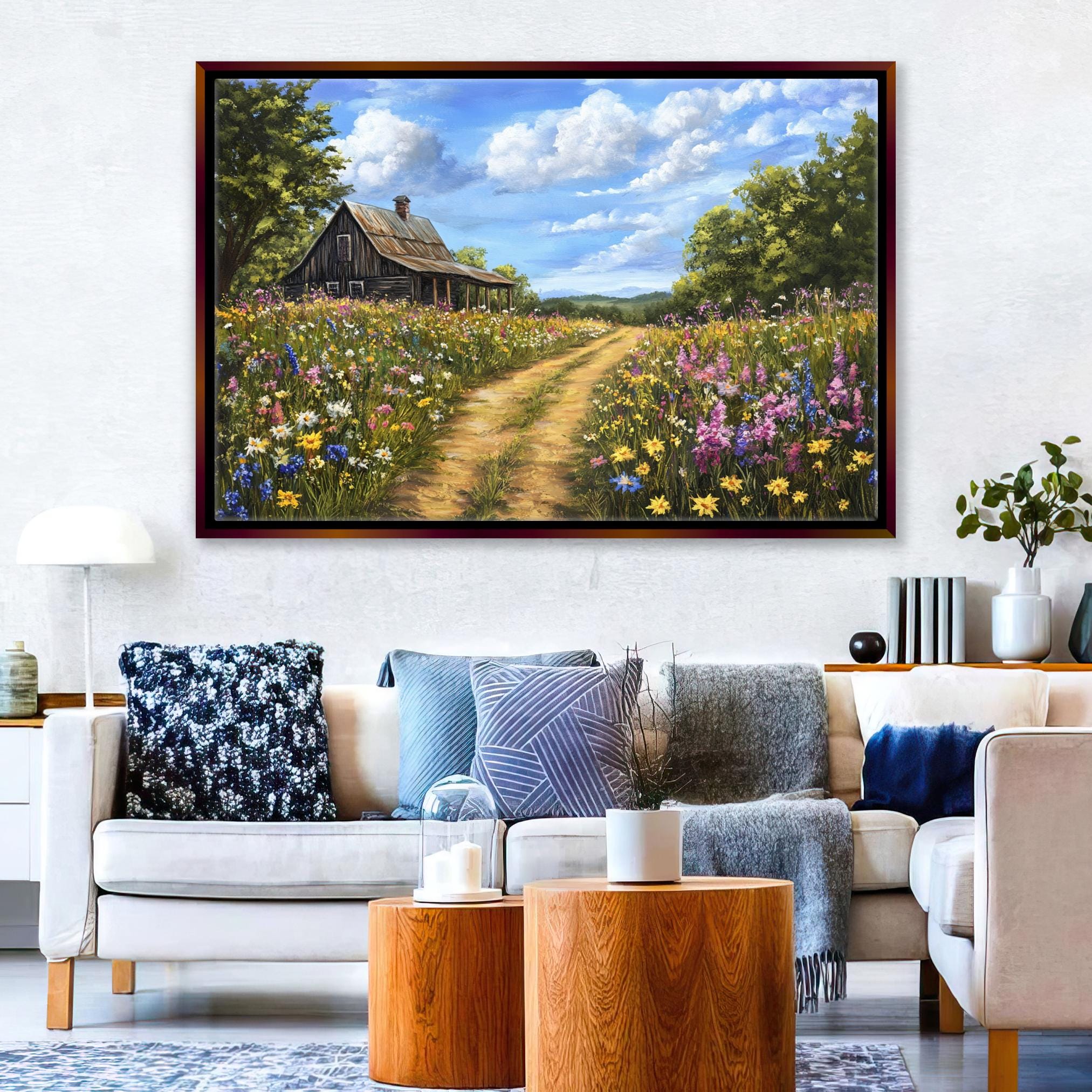 a living room with a couch and a painting on the wall