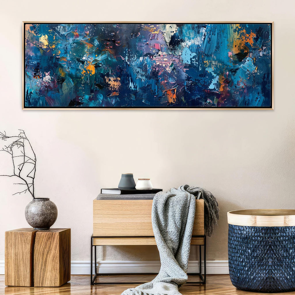 a painting hanging on a wall above a table